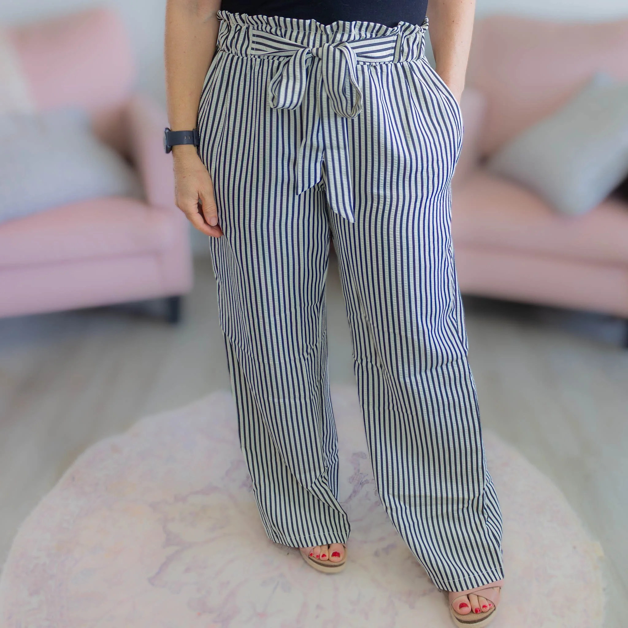 close up of black and white striped pants.