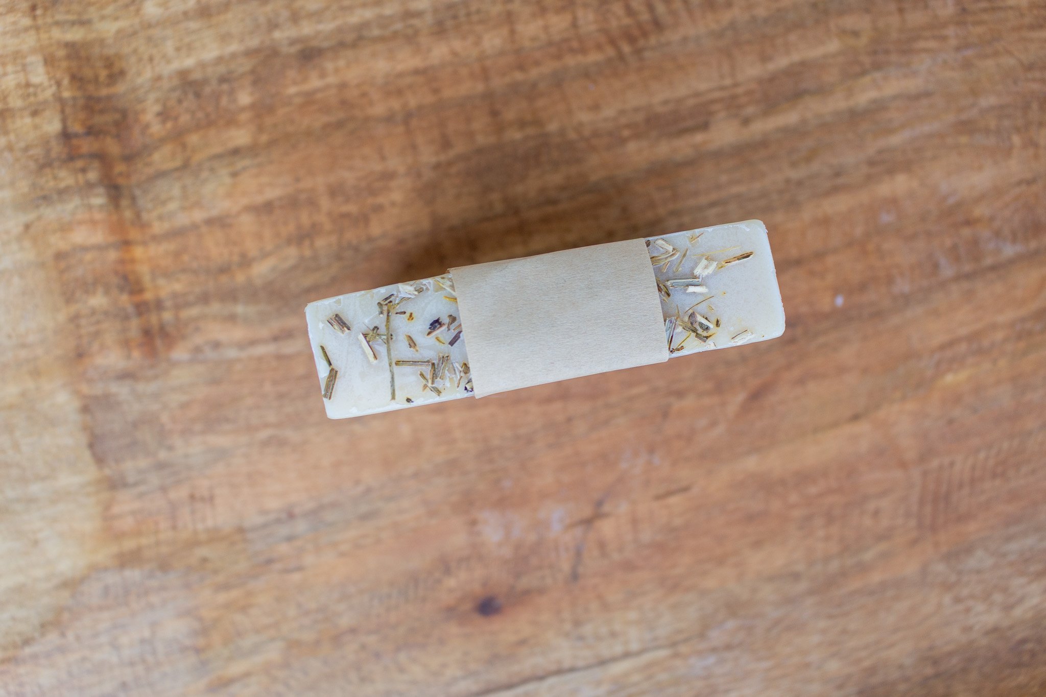 upper view of handmade soap showing bits of greens