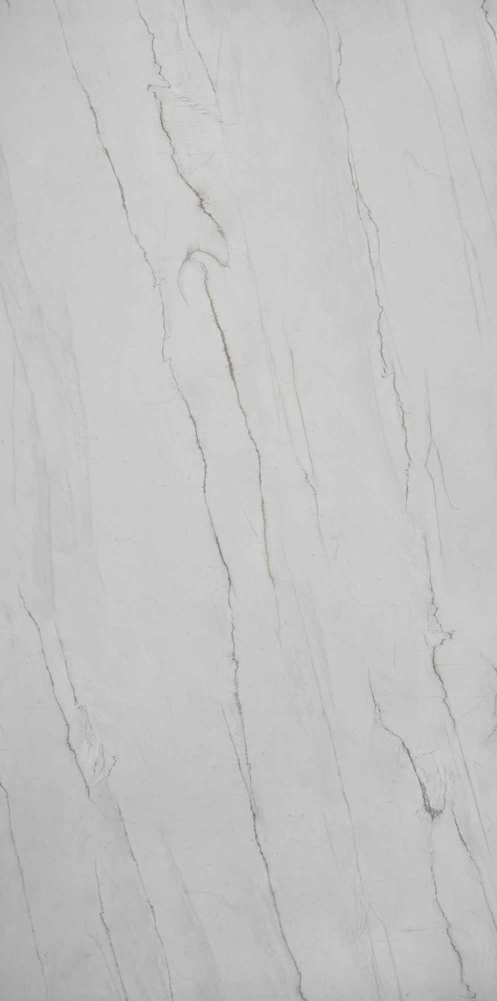 A white marble surface with gray and black veining pattern.