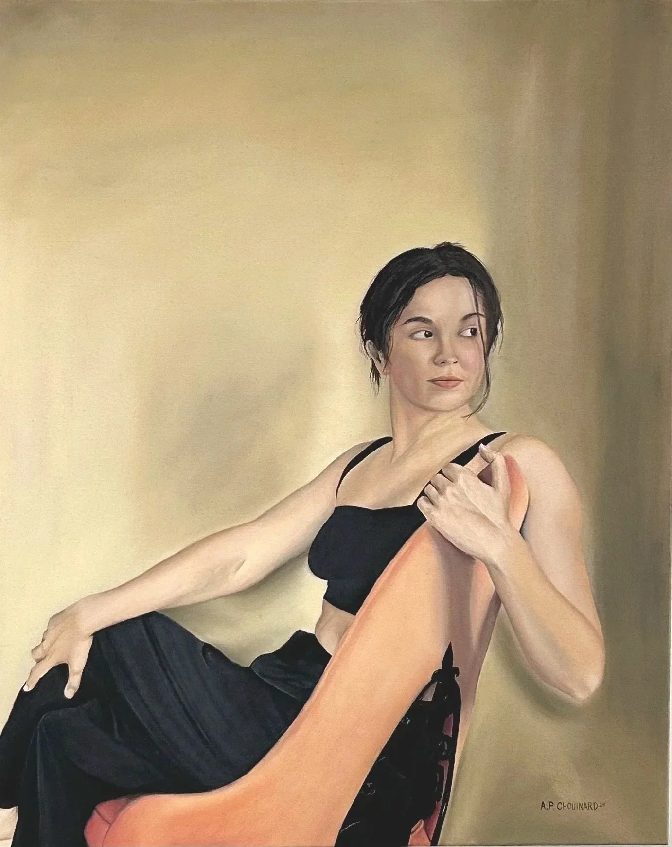 A woman with short dark hair and a black crop top sitting on an orange chair, looking to her left with her right hand on her shoulder and thigh. The background is a plain beige wall. Signed by A.P. Chouinard dated '24.