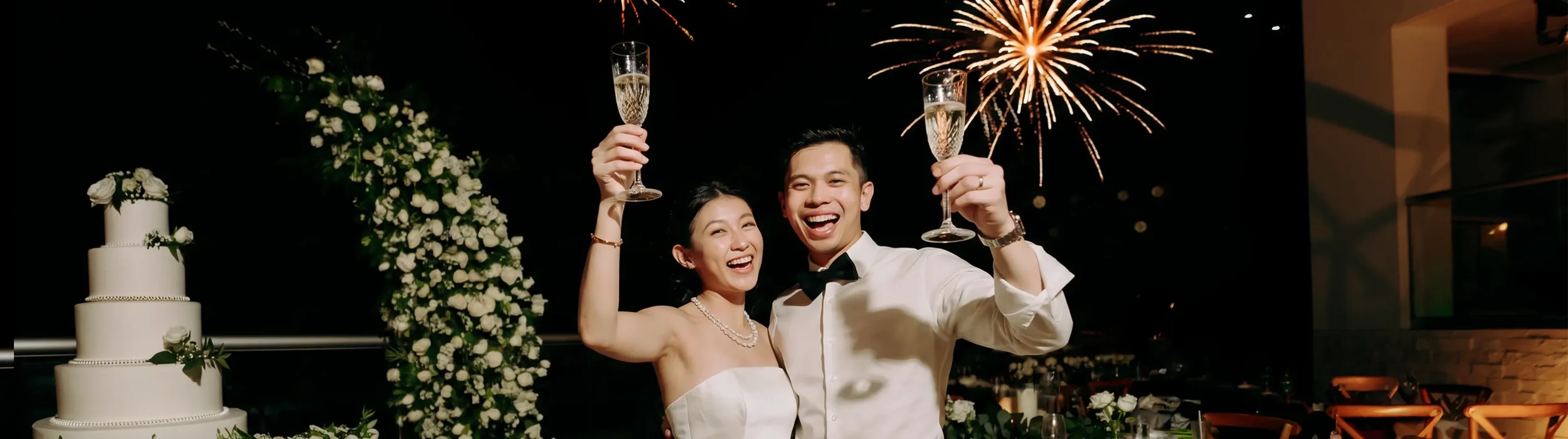 Newlyweds celebrating with champagne and fireworks at Palace Resorts