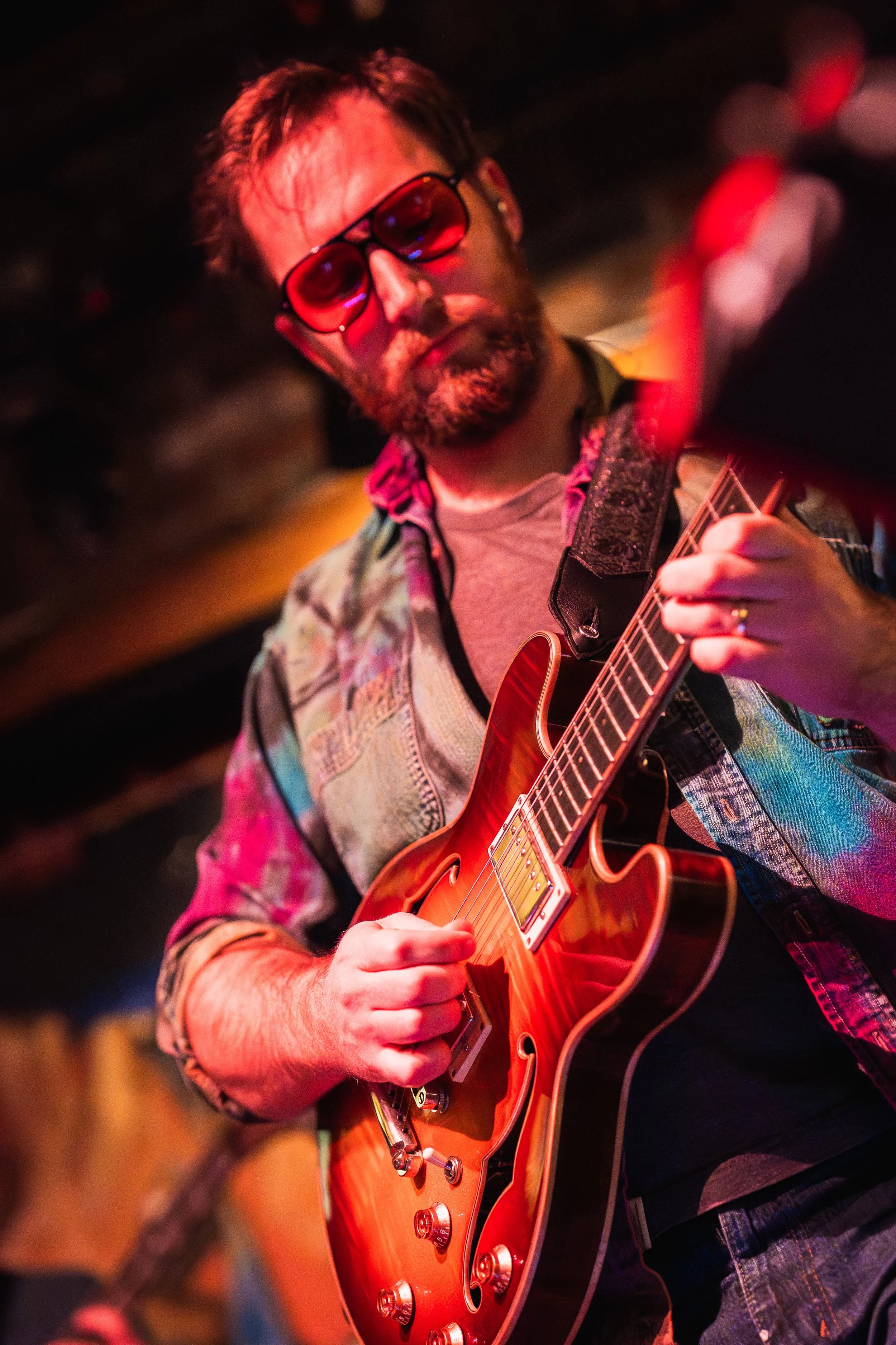 Dan Hiss, lead guitarist for Funk Around & Find Out, playing electric guitar during a live performance.