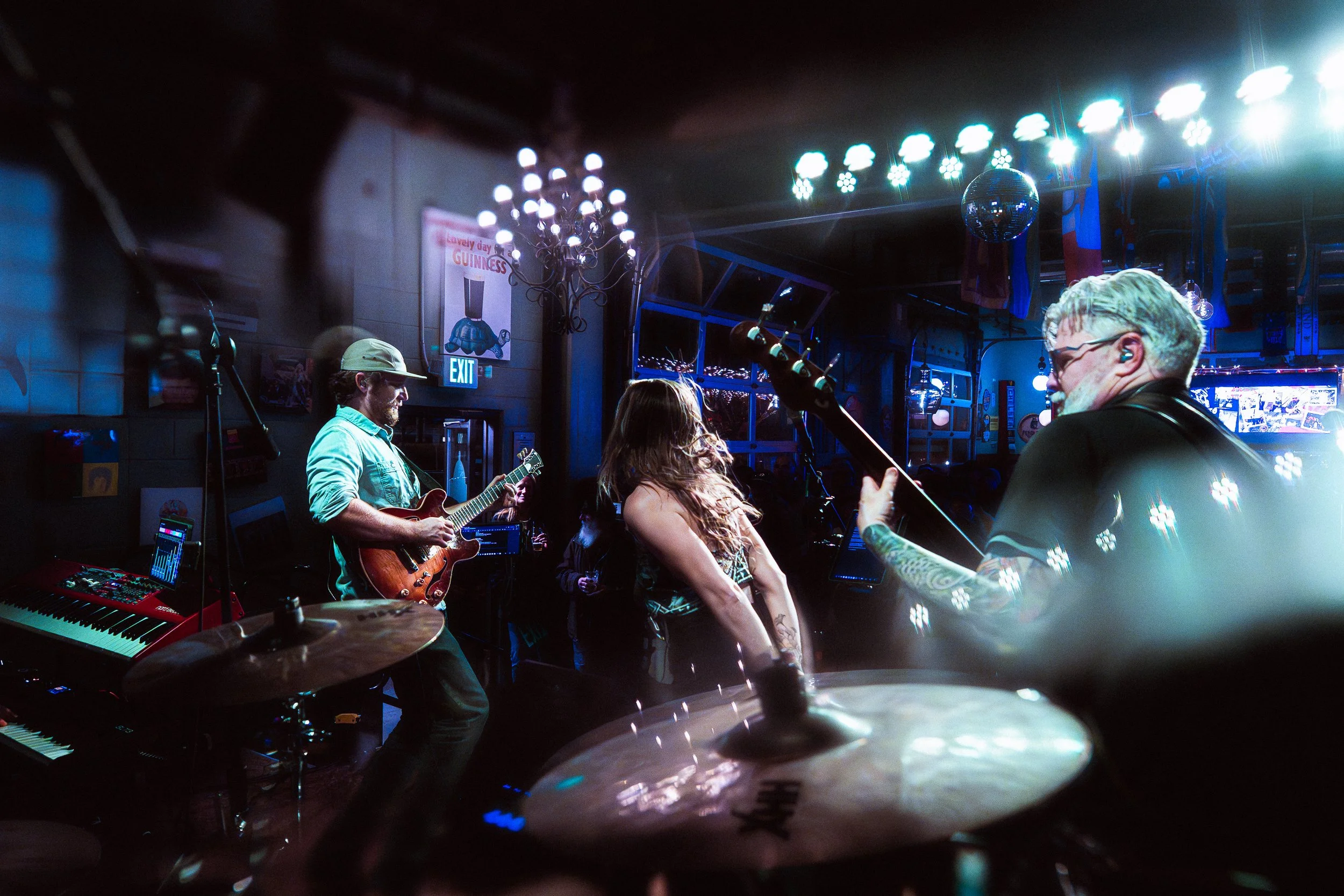 Funk Around & Find Out performing together onstage under concert lighting.