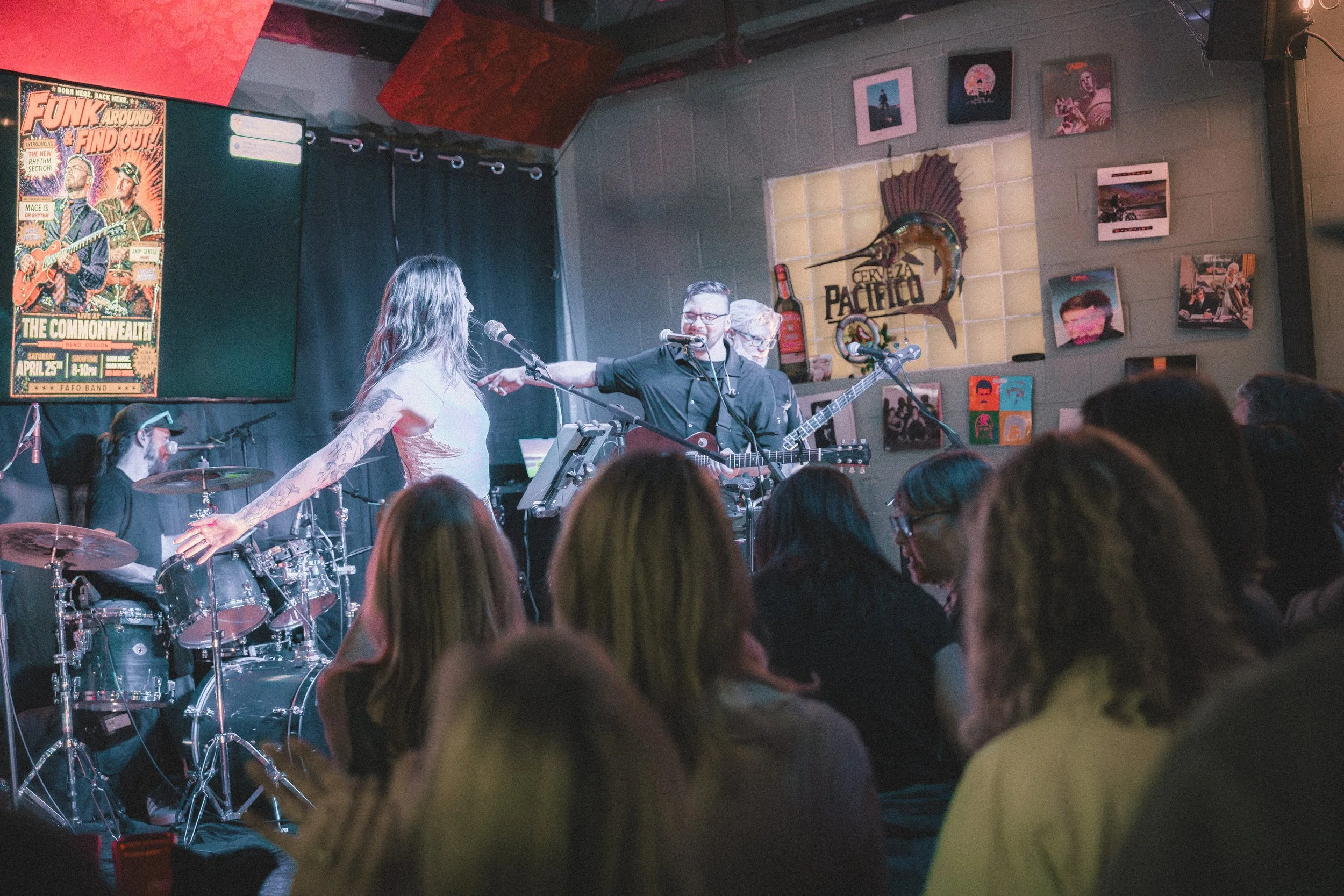 Funk Around & Find Out performing for a crowded dance floor.