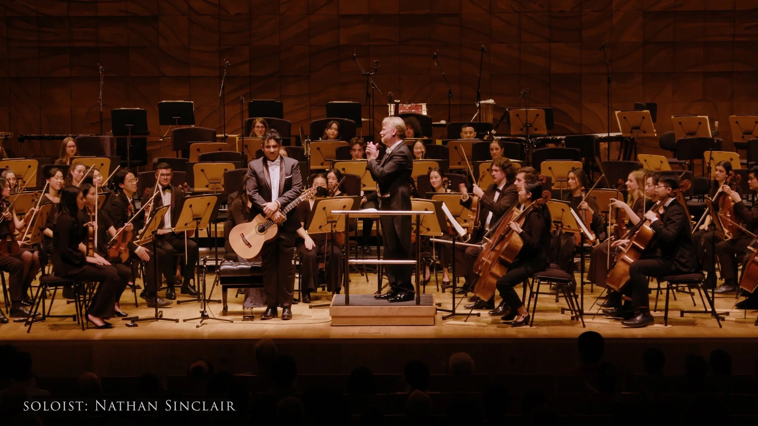 Nathan Sinclair performing with orchestra
