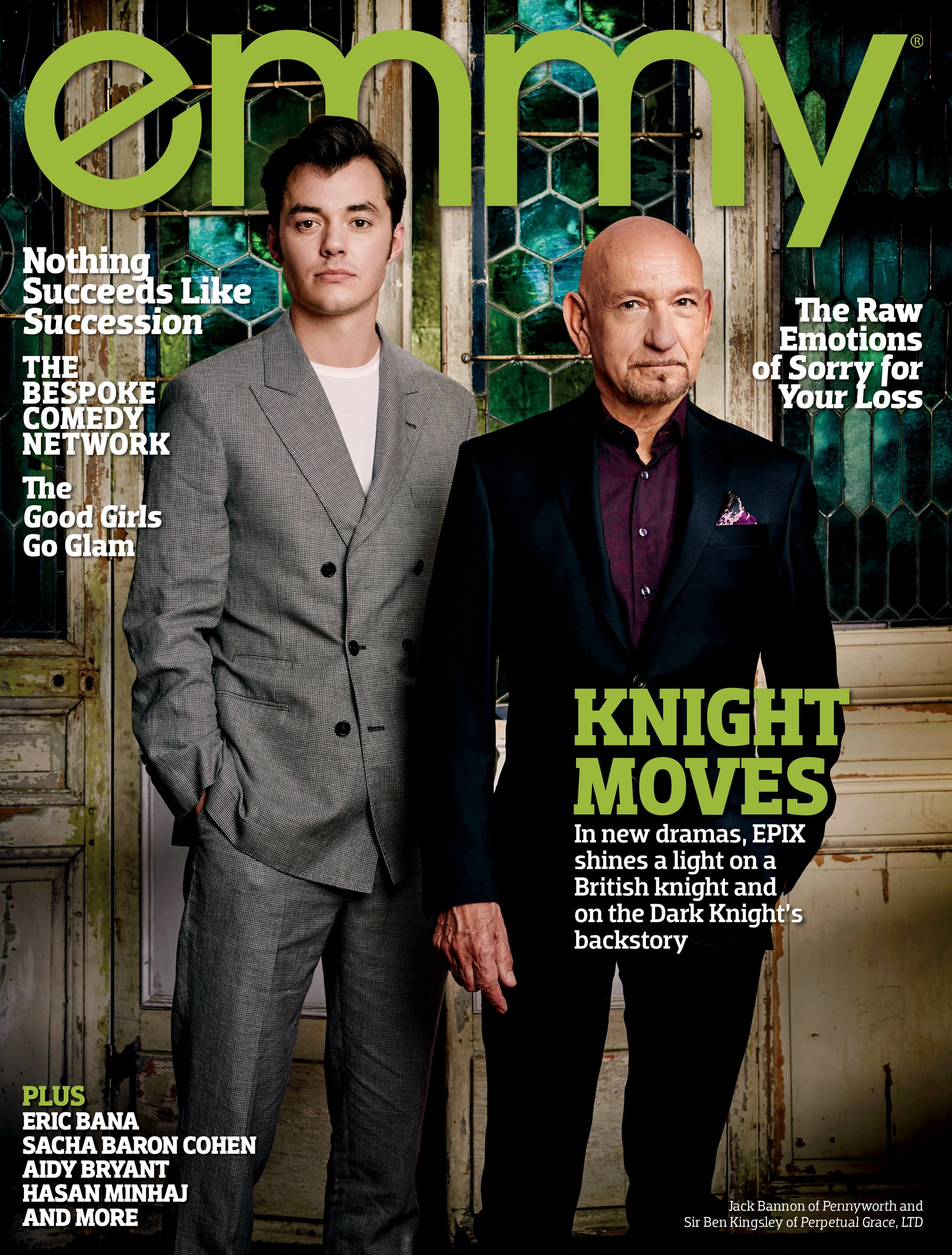 The cover of Empire magazine featuring Jack Bannon and Sir Ben Kingsley standing side by side indoors. Jack Bannon is dressed in a light gray patterned suit with a white shirt, and Sir Ben Kingsley is wearing a dark suit with a purple shirt and a purple pocket square. The background has a rustic look with a window showing greenery outside, and the magazine's title 'empire' at the top in large green letters.