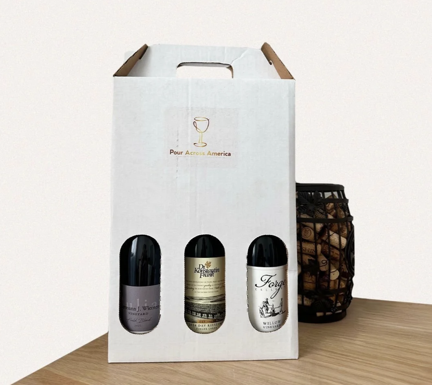 Explore unexpected wine regions from home with a curated 3-bottle wine delivery box from Pour Across America, featuring hand-selected wines, tasting notes, and stories behind every bottle.