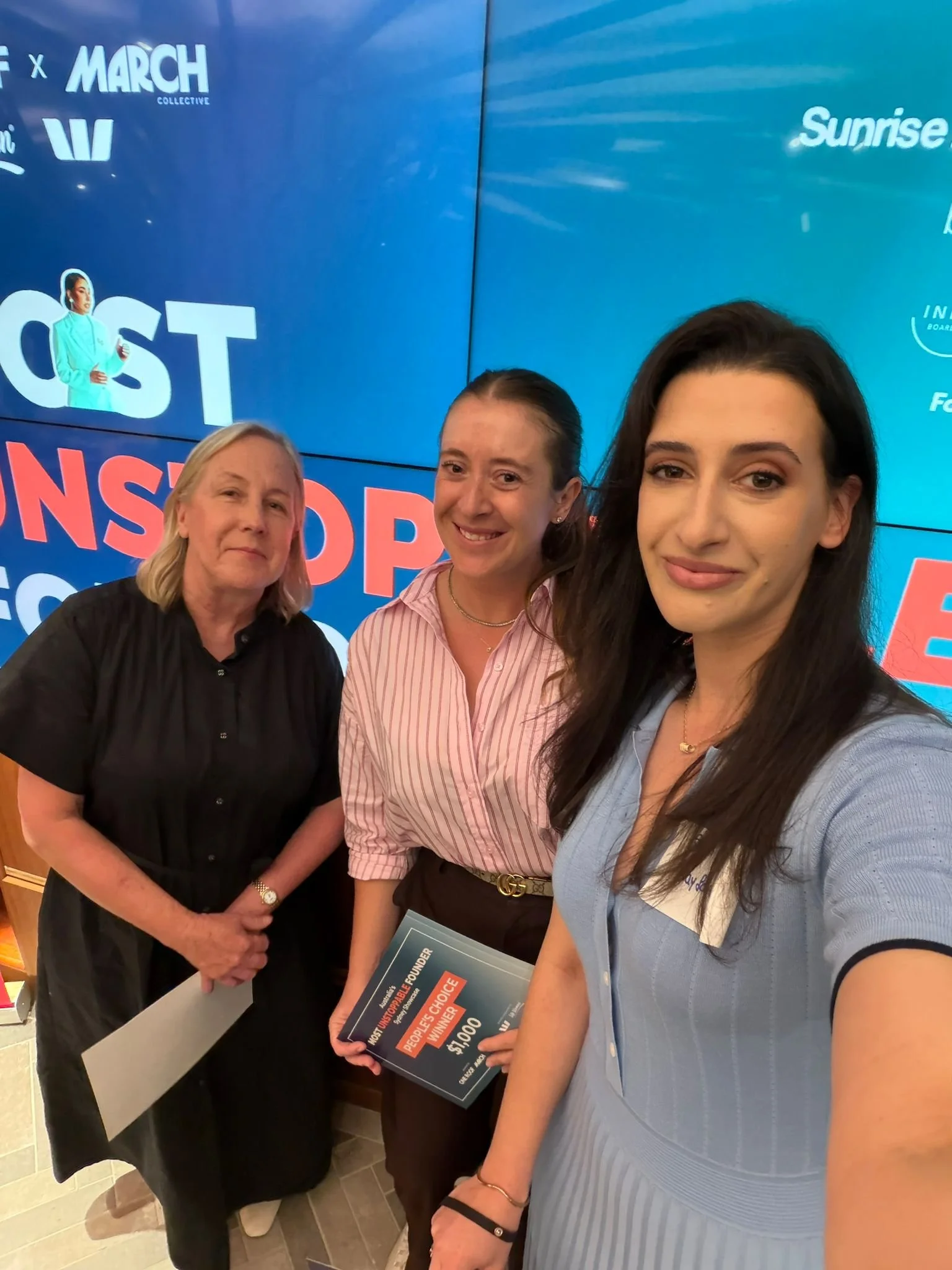 Sam Freidin, co-founder of Wayfarer Mobility at the Australia's Most Unstoppable Founder Showcase in Sydney, pictured with first place winner, Sarah Alcock from Tomcare and Catherine from Support Plus.