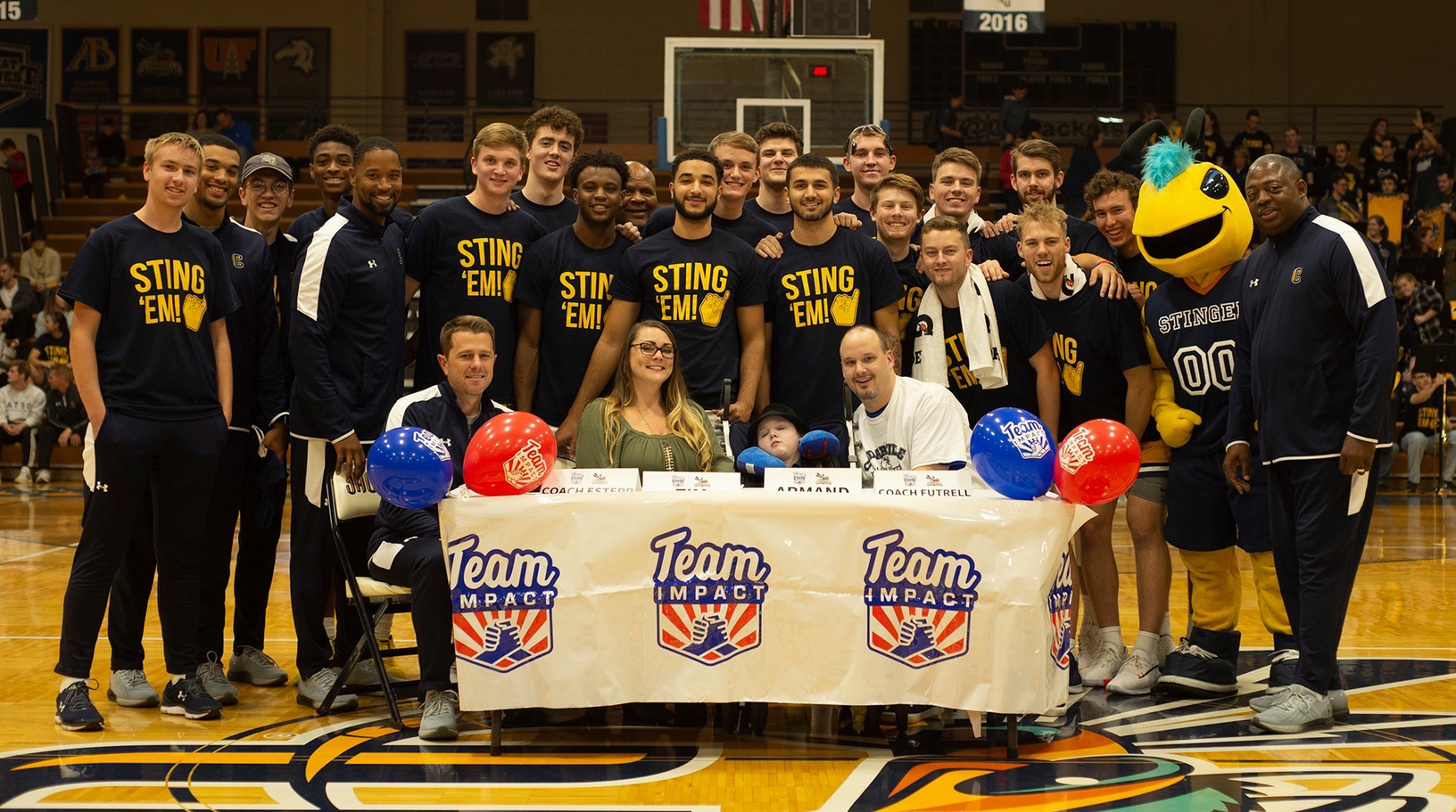 Cedarville Students take a photo with Sting 'Em! shirts on