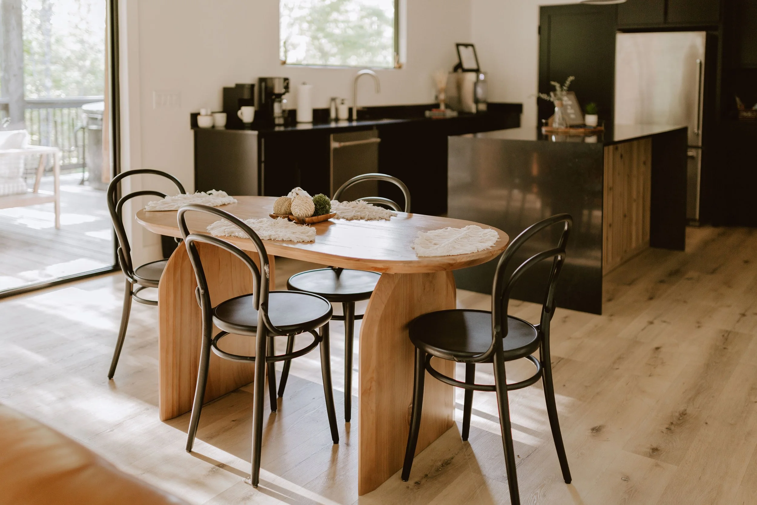 Modern dining area at Hygge Hill, a modern cabin, in Broken Bow/Hochatown, OK.