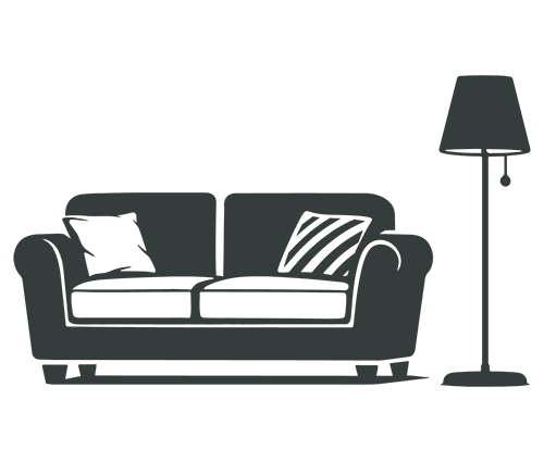 Silhouette of a sofa with two cushions beside a tall floor lamp.
