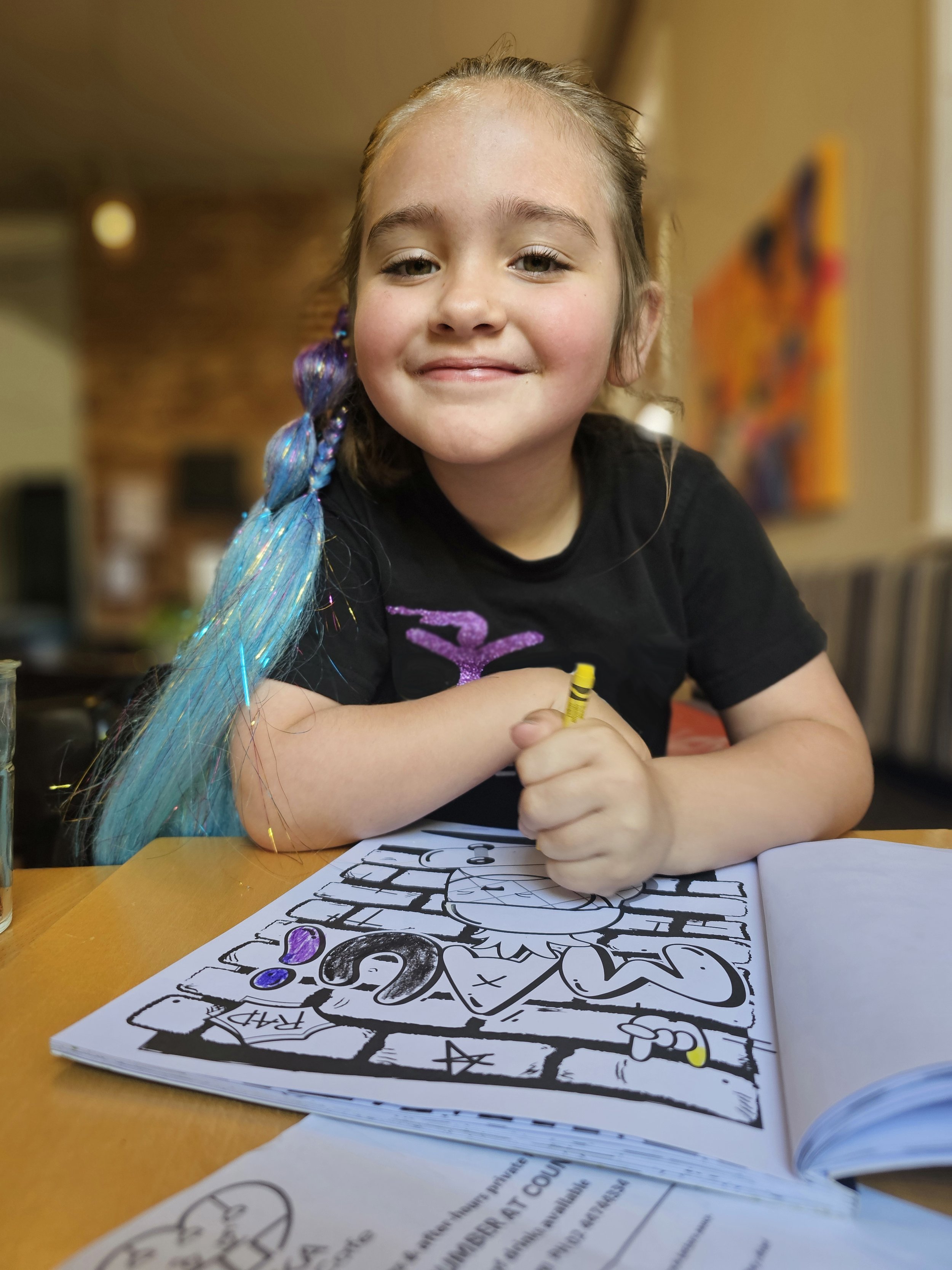 Young Smily Girl colouring in