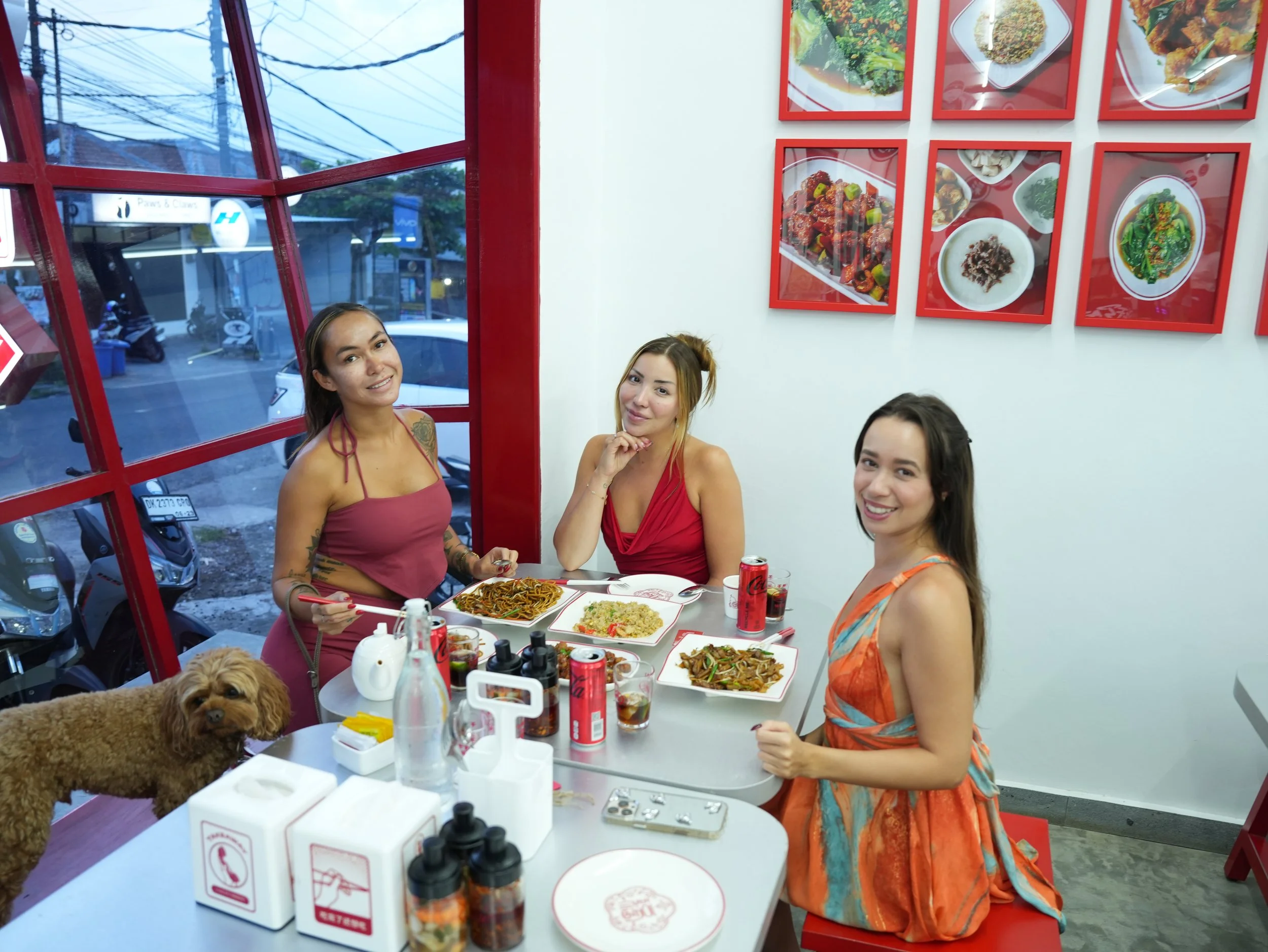 Friends sharing noodles, fried rice, and stir-fried dishes at Wok This Way, the best Chinese food in Canggu