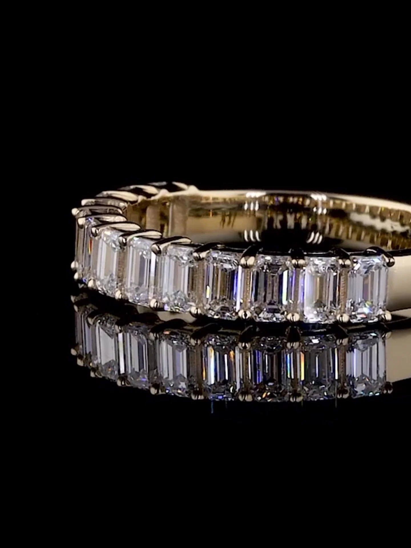 The ring that people can&rsquo;t stop inquiring about, and we don&rsquo;t blame them. This half eternity band, adorned with emerald cut diamonds is truly mesmerizing. It catches everyone&rsquo;s attention as soon as you walk in the room. 

For him or