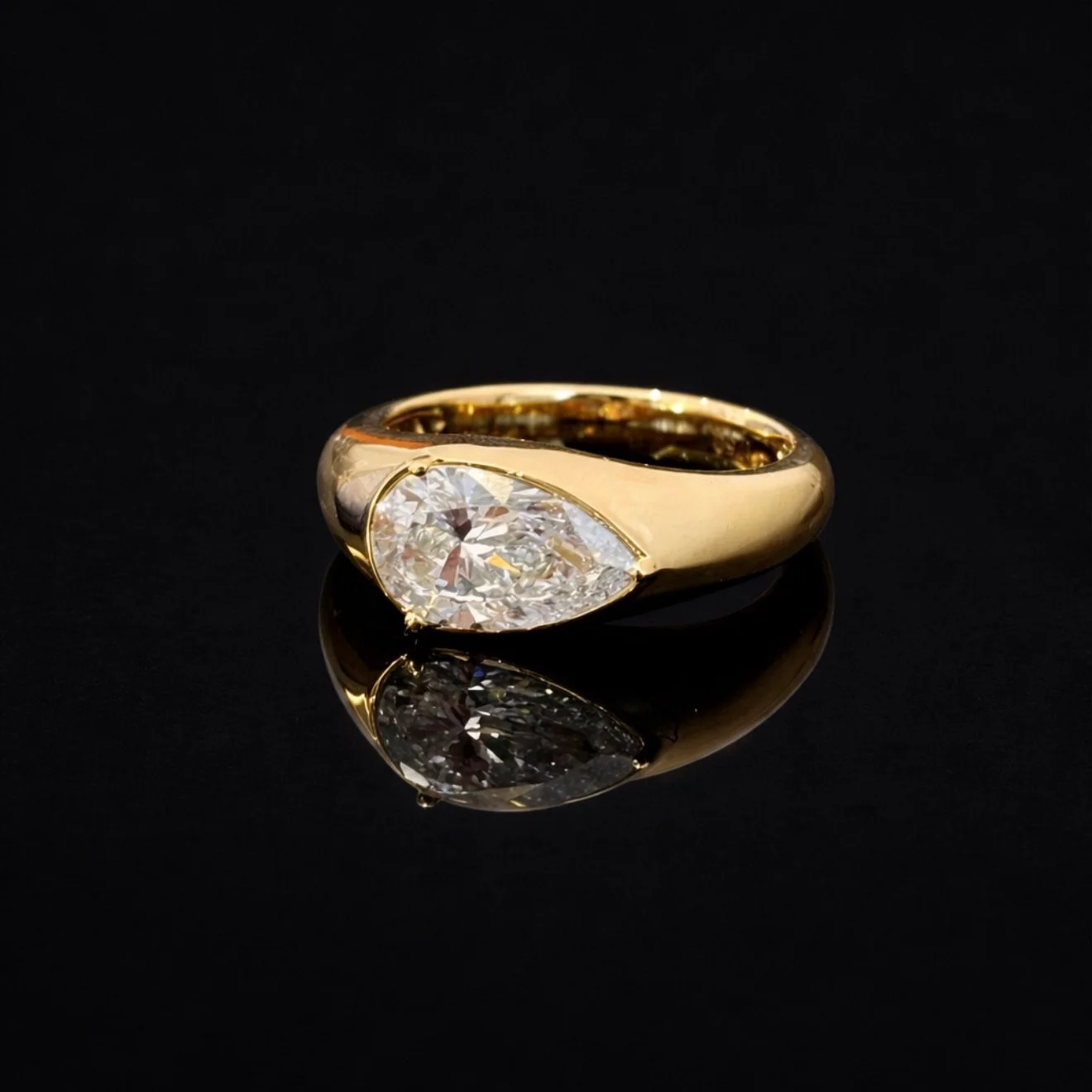 Sculptural yellow gold paired with a luminous 2ct pear diamond, a modern heirloom in the making ✨