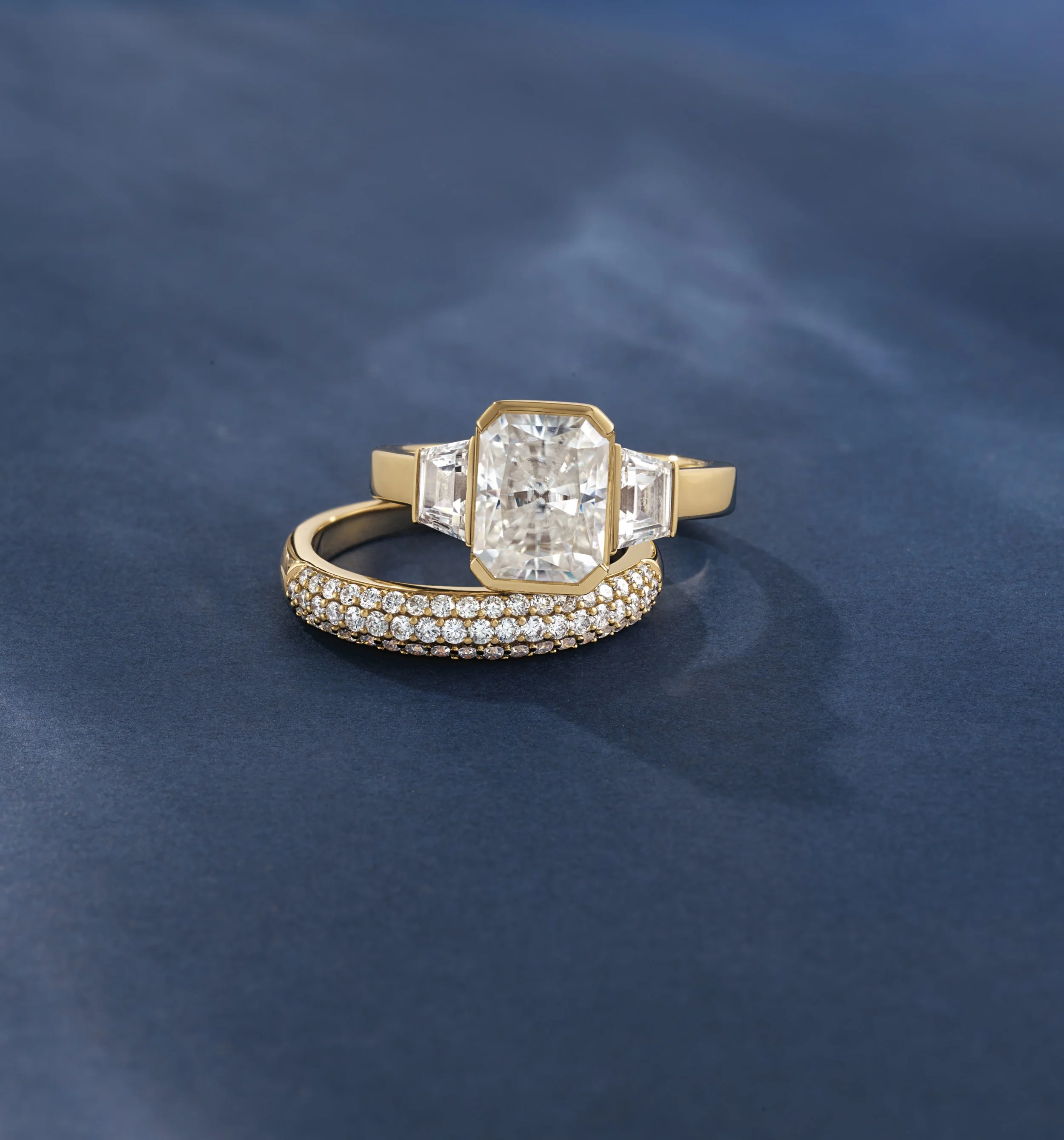 The perfect, no so average, bridal set ✨ A bezel set trilogy ring paired with a triple pav&eacute; wedding band all in 14k yellow gold

#weddingband #engagementring #naturaldiamonds #labgrowndiamonds #vancouver