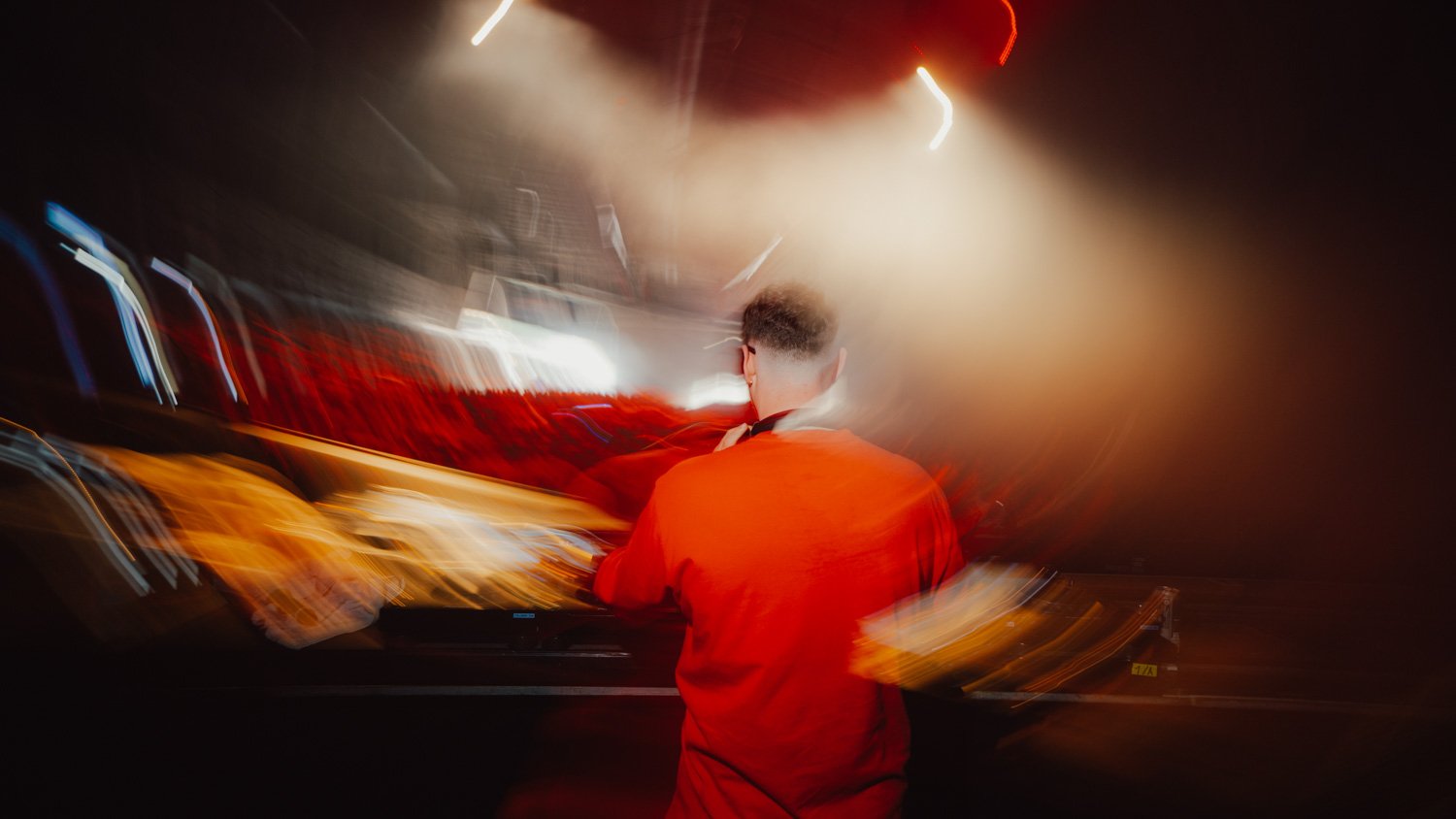 Club show photography of YouNotUs performing in a packed venue, shot by an experienced club photographer specializing in low-light concert visuals.