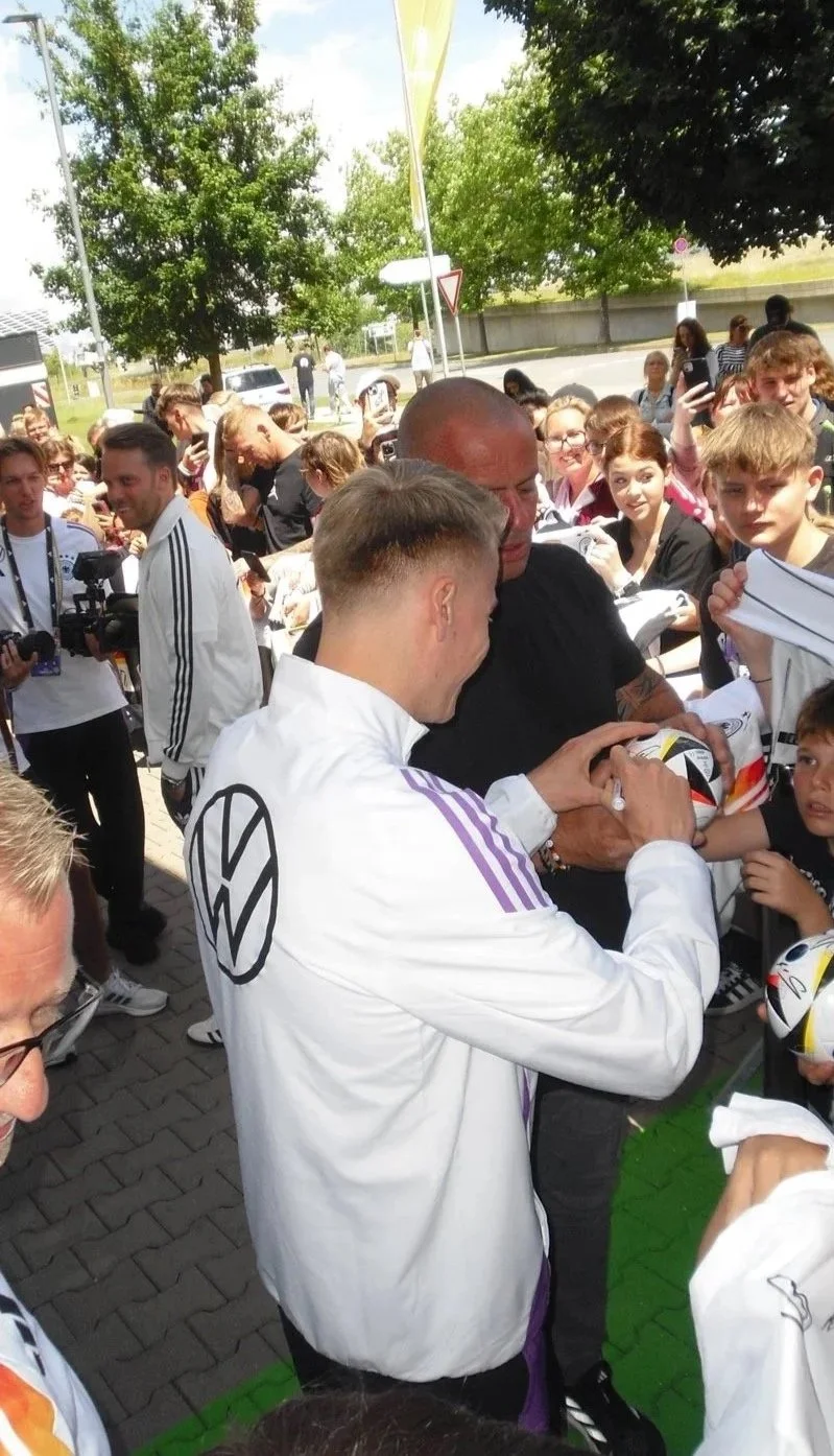 Event recap video capturing fan interactions during an Adidas and DFB autograph session at the UEFA EURO.