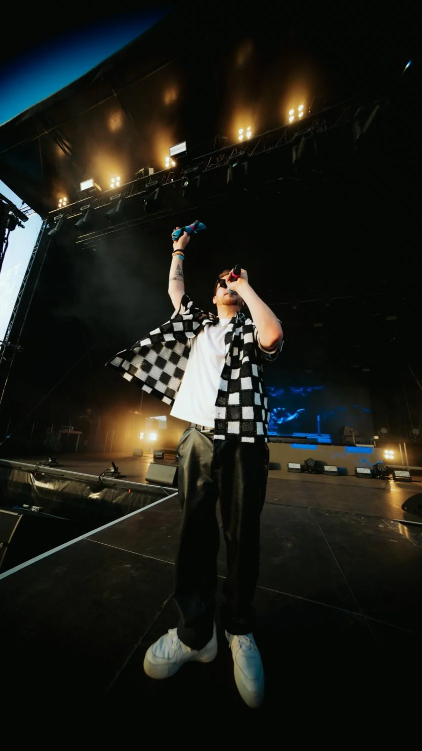 Live concert photography capturing the interaction between YouNotUs and the audience during a high-energy festival performance.