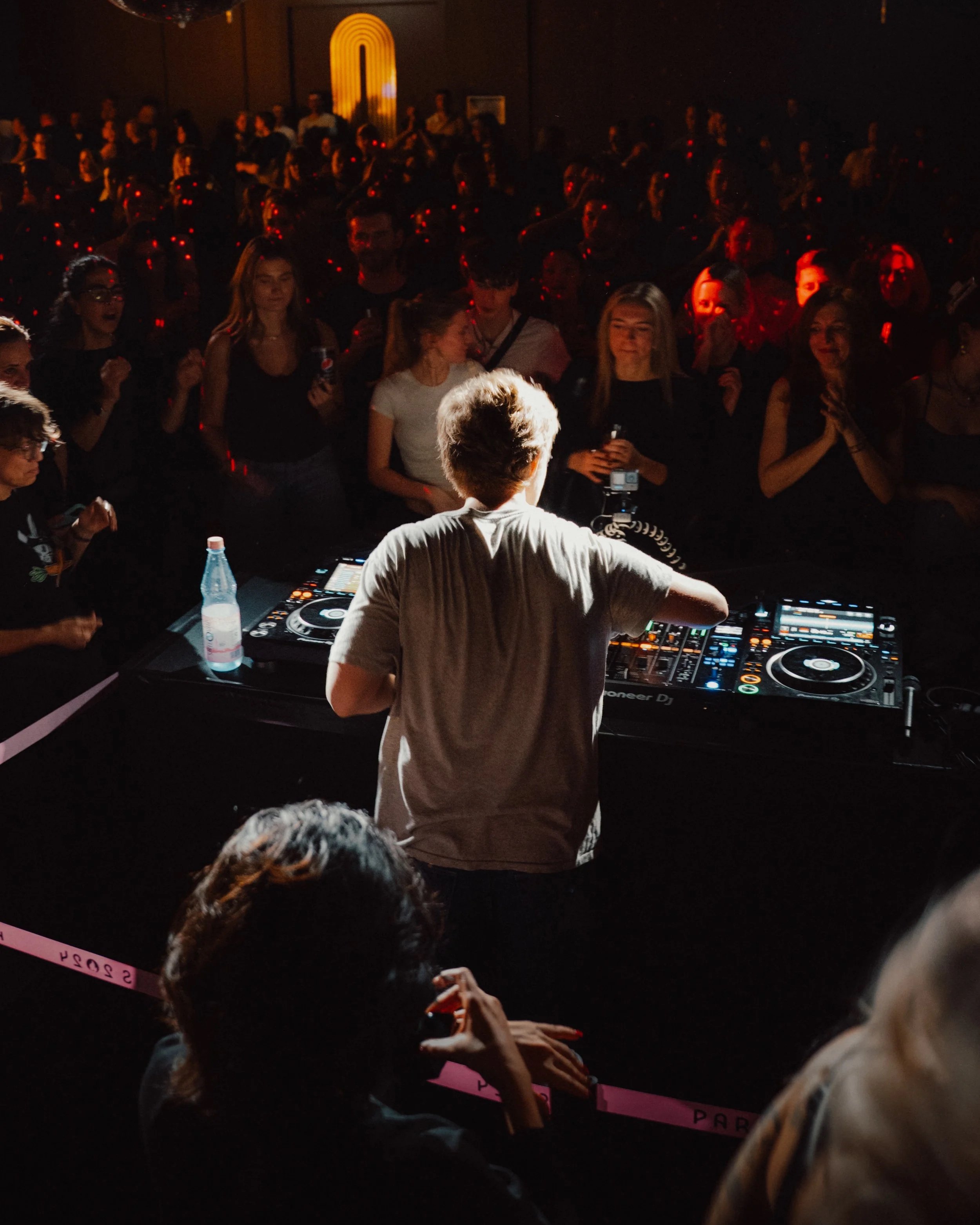 Wide-angle concert photography showing Oskar med K on stage with the venue and audience in Berlin.