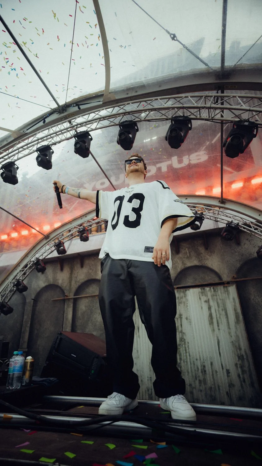 High-impact festival photo optimized for social media, showcasing YouNotUs during a live DJ set with strong visual composition.