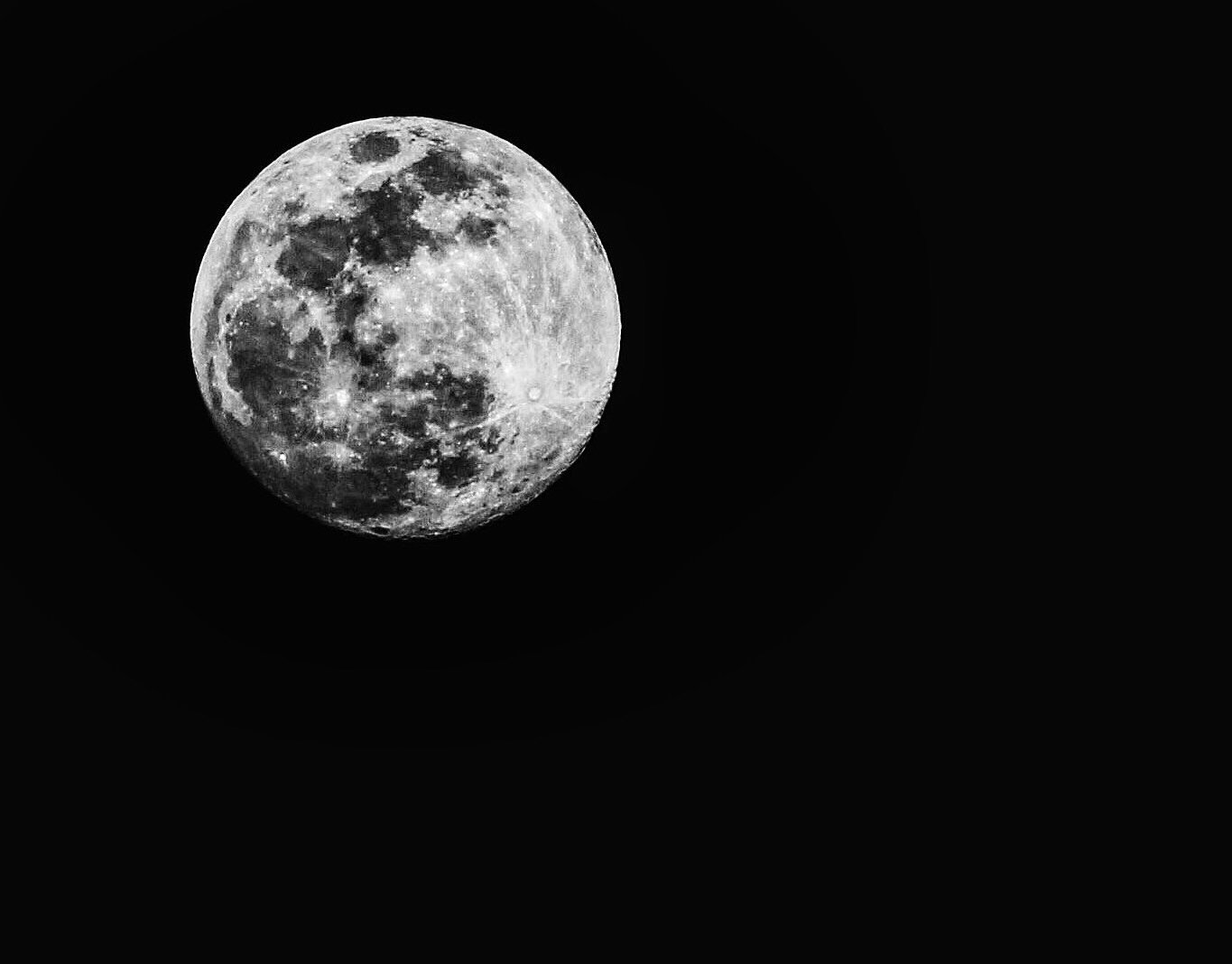 Full moon in a dark sky.
