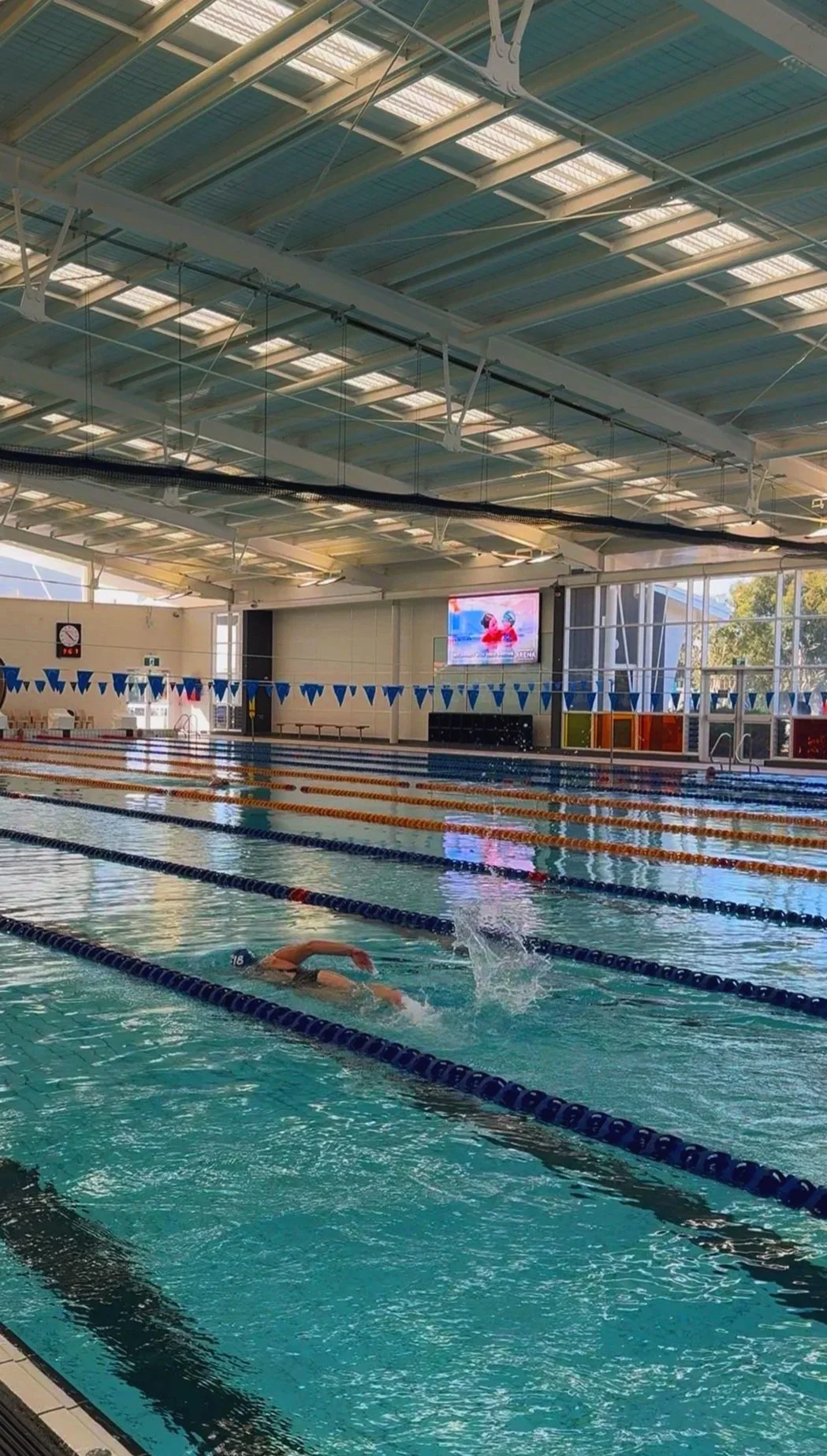 leisure centre lap pool with a swimmer