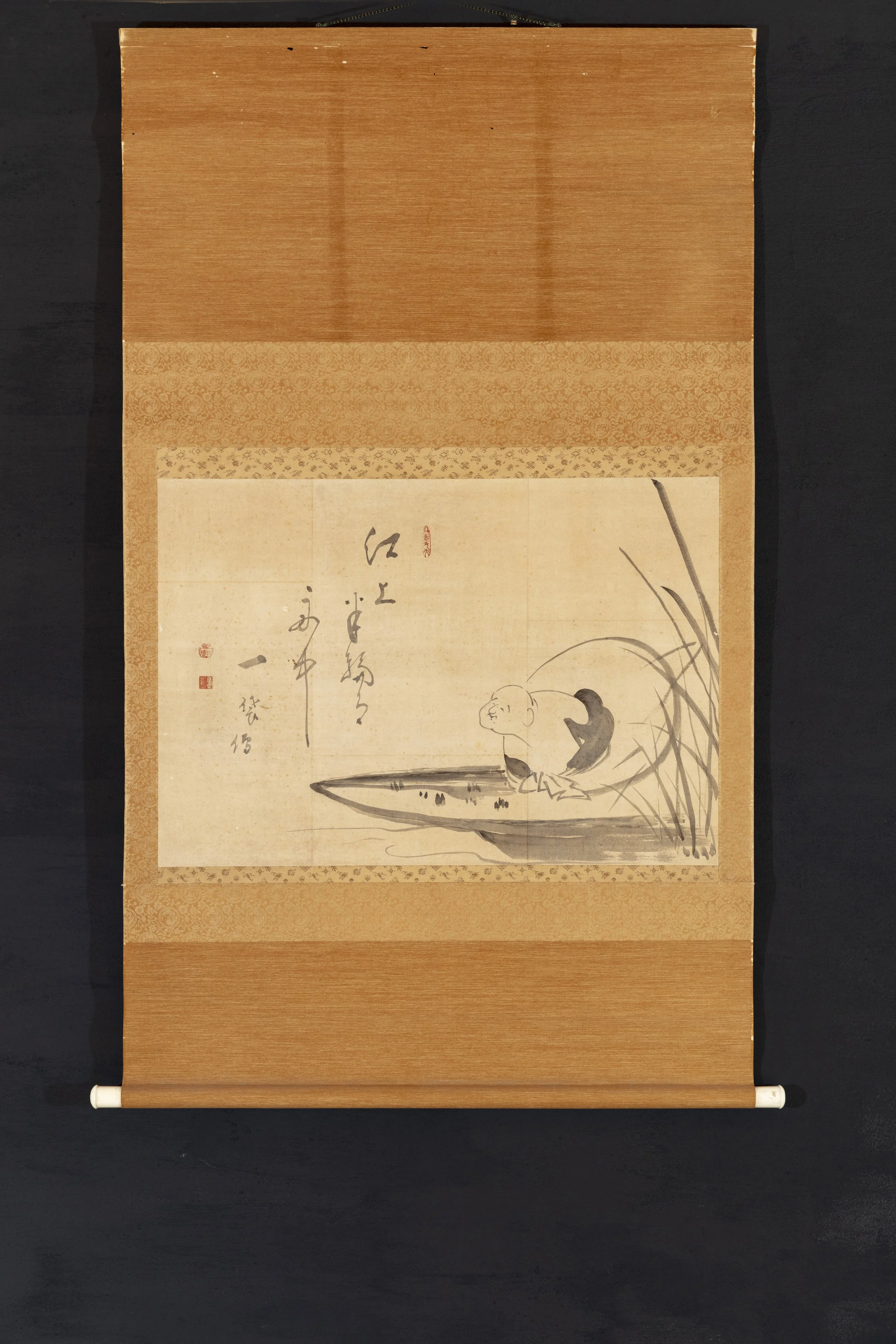 Full view of Hotei in a Boat hanging scroll.