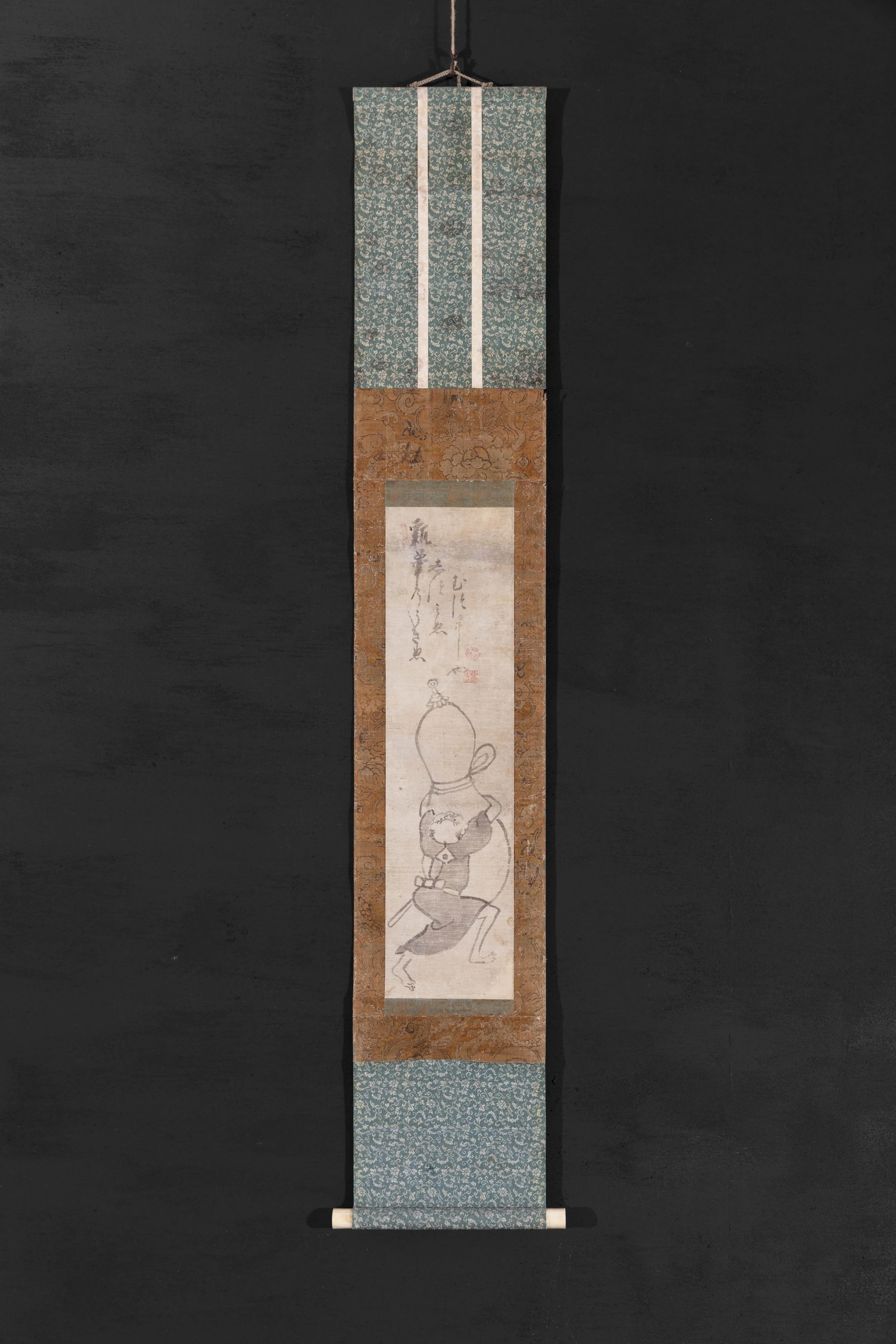 Full view of Samurai Straining to Grasp a Gourd, attributed to the circle of Hakuin Ekaku, with the complete hanging-scroll mounting visible.