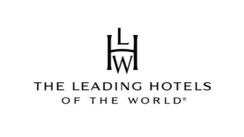 Nighttime cityscape with illuminated buildings and streetlights