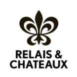 A black background with a gold fleur-de-lis symbol at the top center.