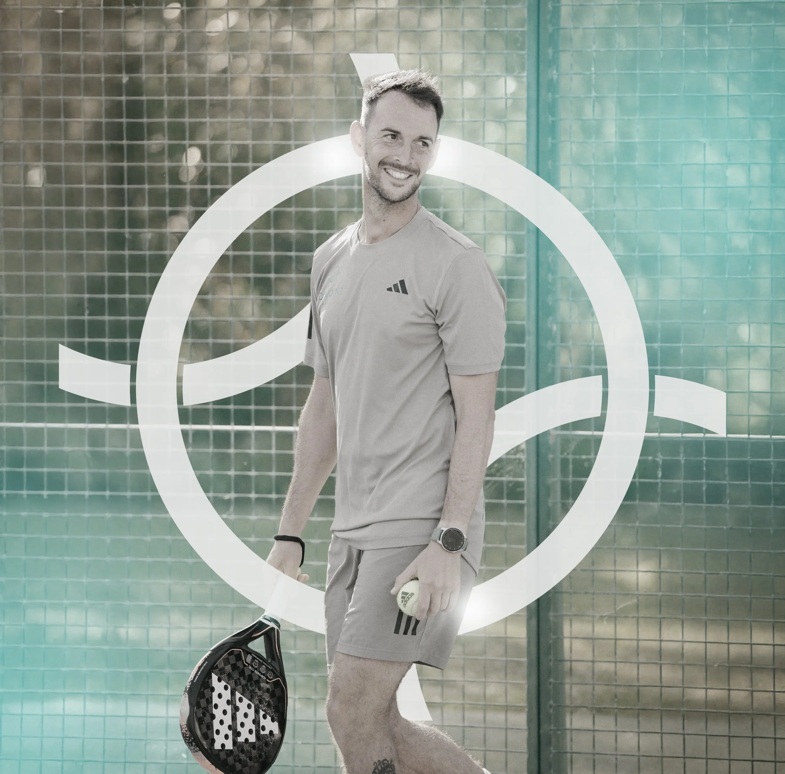 A man smiling, dressed in sportswear, holding a padel racket and ball on a paddle court with a wire fence background and a graphic design overlay.