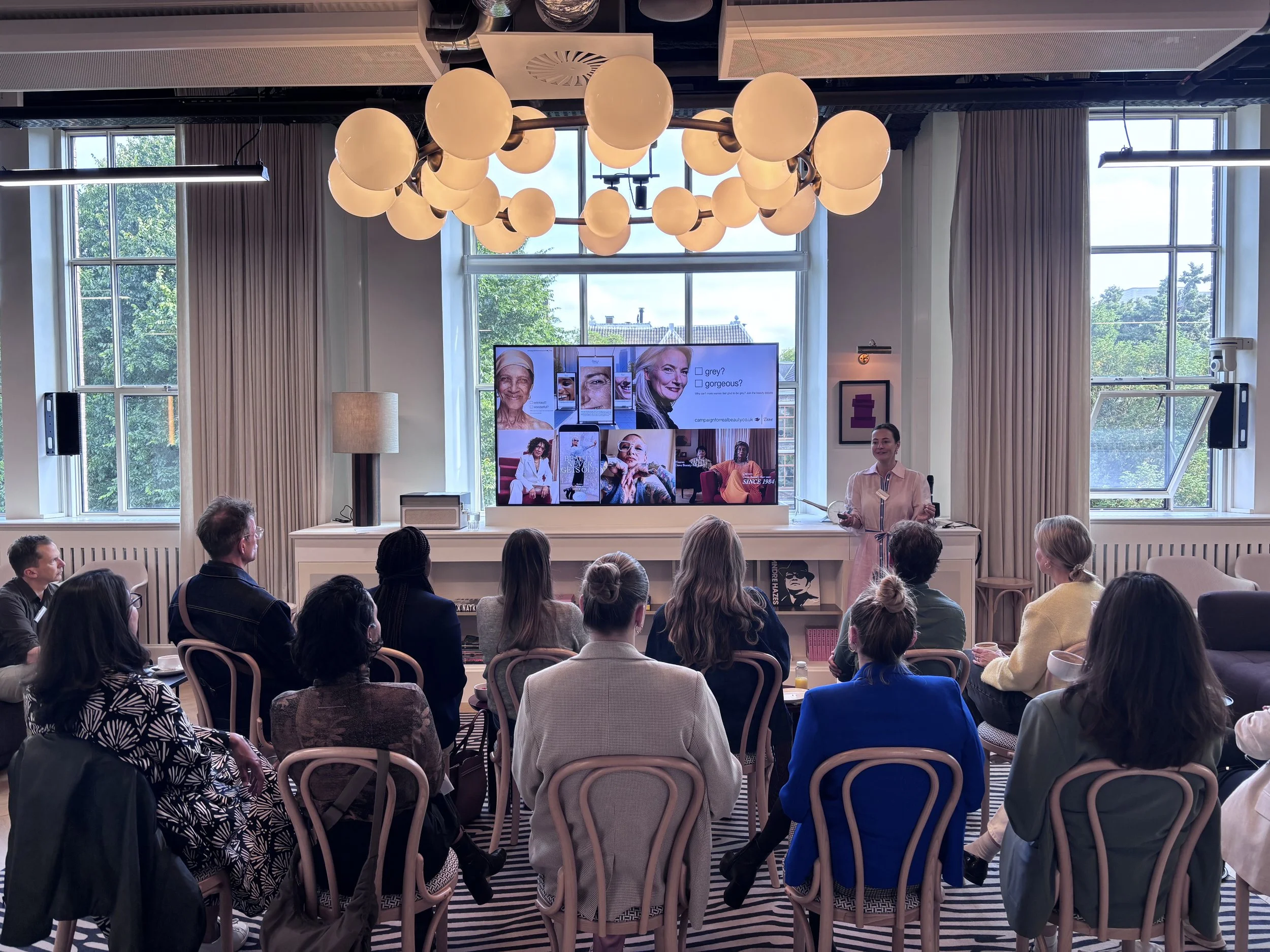 Christiana Courtright presenting a speech on ageism in advertising to senior marketing leaders across the Netherlands.