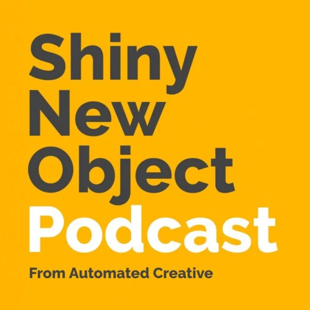 A yellow poster with bold black and white text that reads 'Shiny New Object Podcast from Automated Creative'.