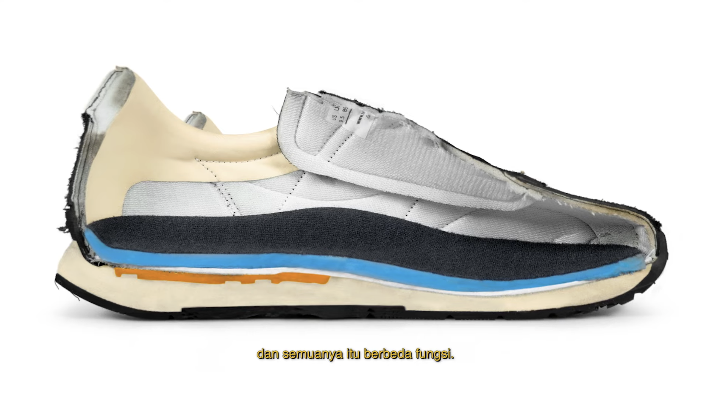 Cross-sectional view of a sneaker showing various internal layers, including foam, fabric, and support materials.