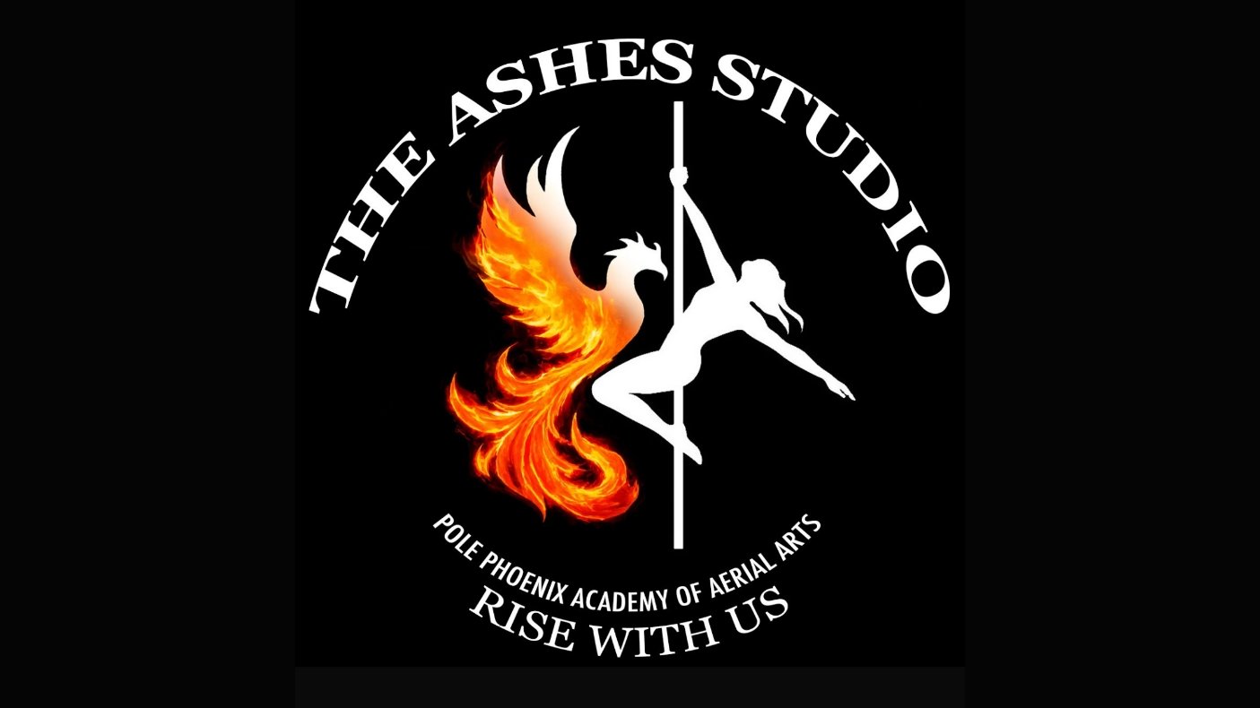 A logo for The Ashes Studio, featuring a stylized phoenix with fiery orange and yellow flames, a silhouette of a female pole dancer on a pole, and circular text reading 'The Ashes Studio', 'Pole Phoenix Academy of Aerial Arts', and 'Rise With Us' on a black background.