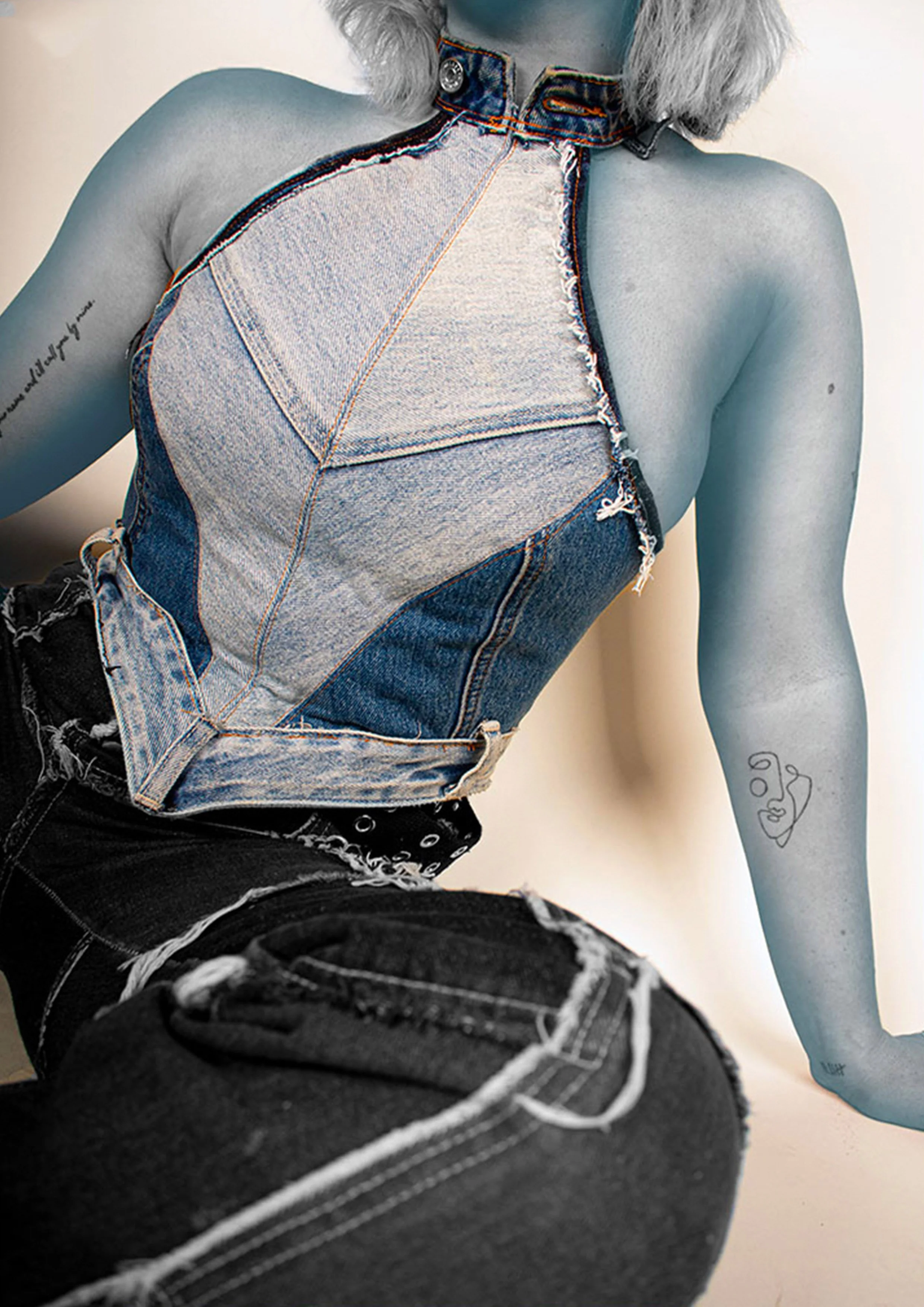 An alien-skinned model wears the upcycled jeans boned bodice. It is made using varying shades of denim jeans, with original seams used decoratively, and the original waistbands used for the hem and collar.
