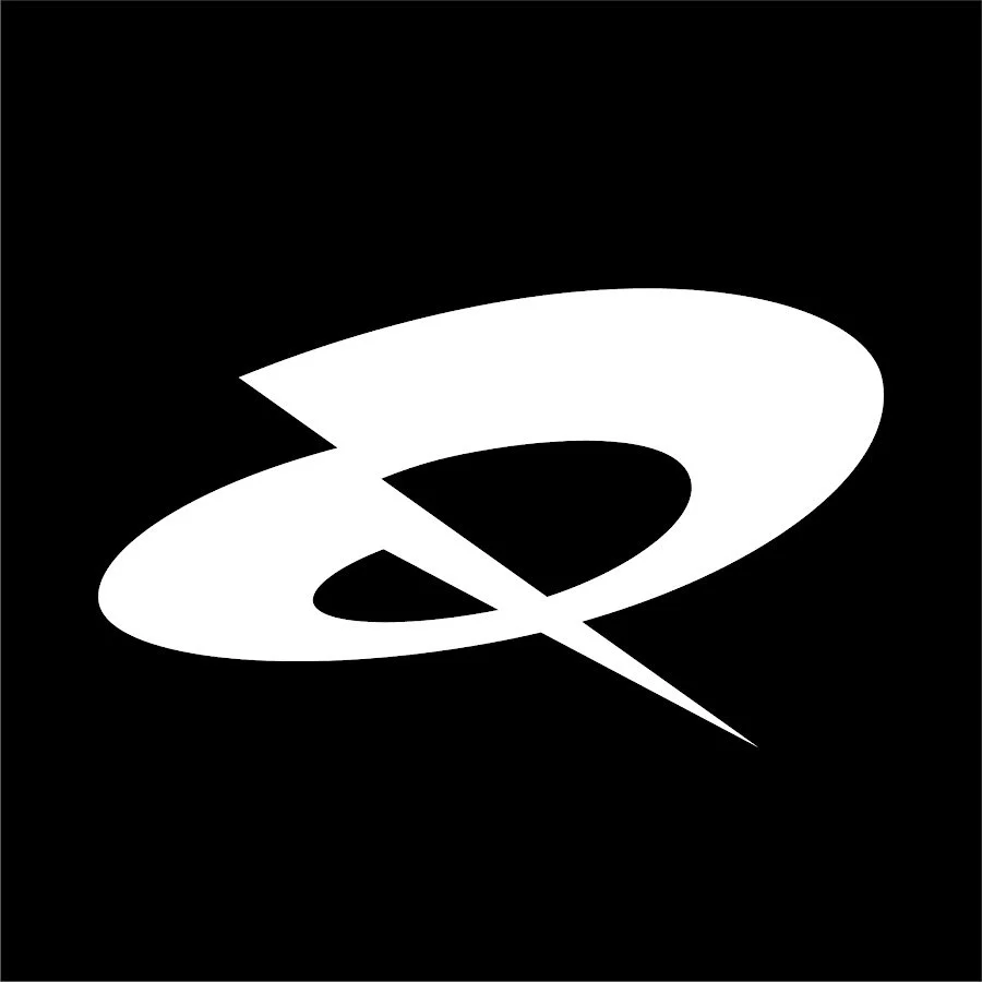 Black background with a white stylized planet and ring logo. Quadrant Logo.