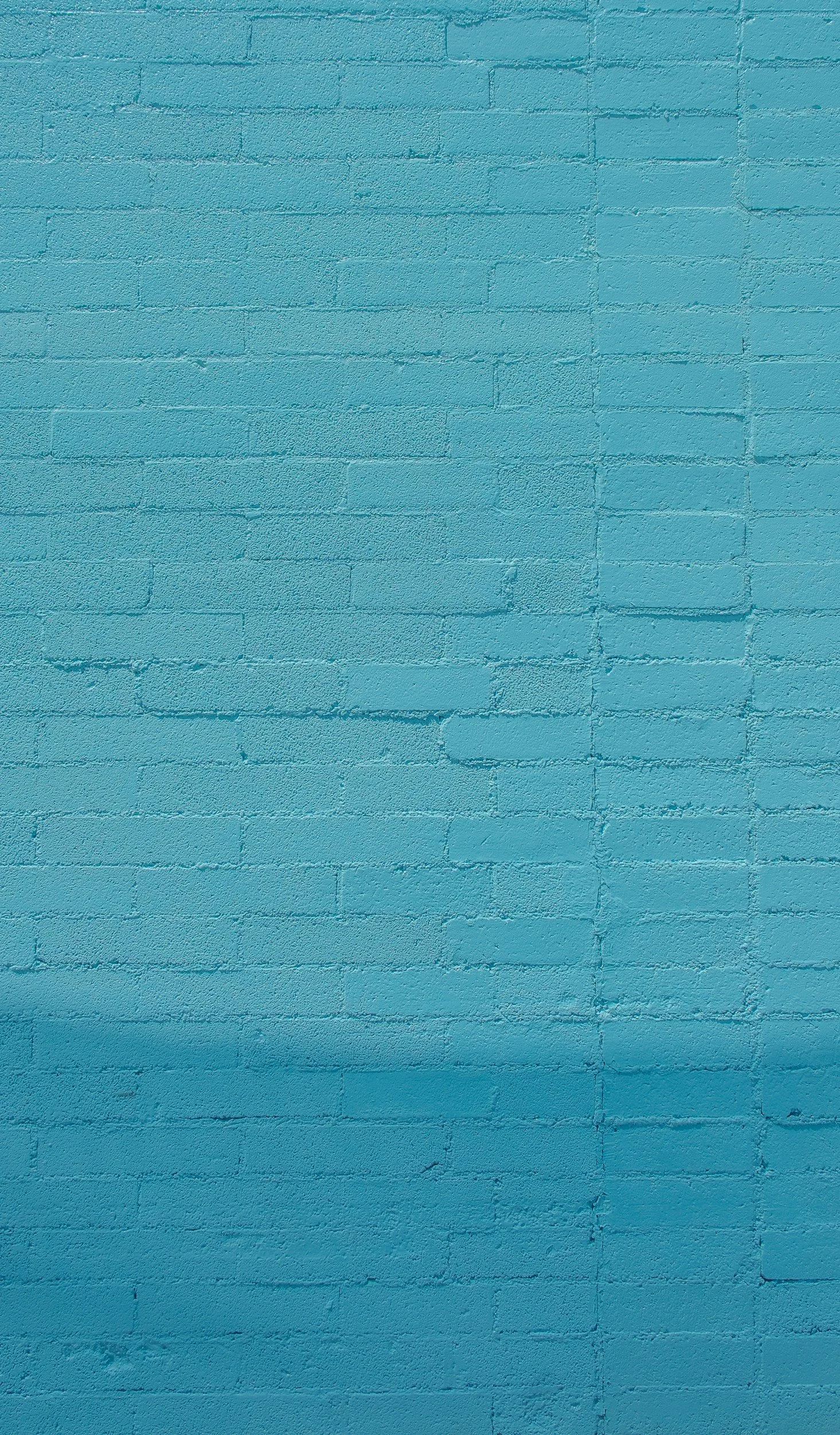 Blue painted brick wall.