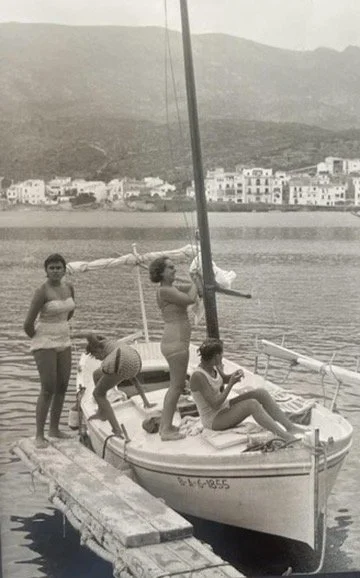 Historic Mediterranean sailing culture in Cadaqués during the 1950s.