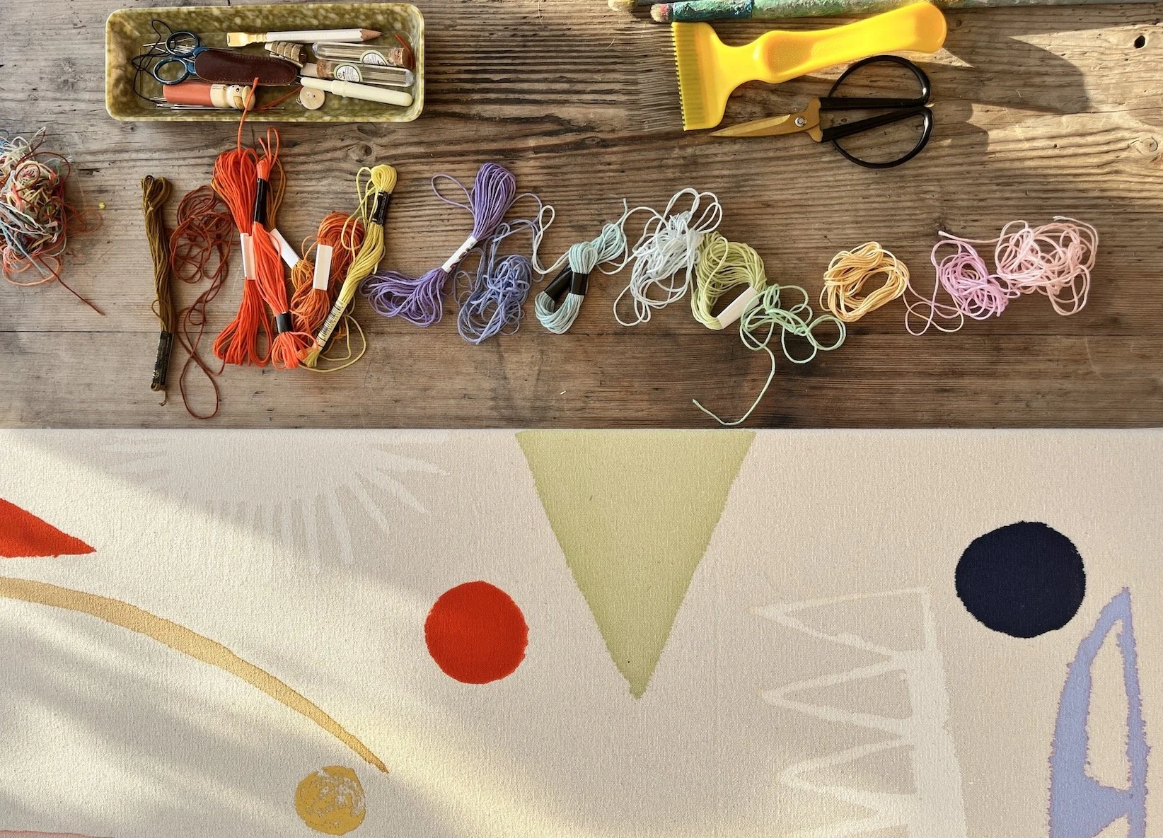 becky-blair-top-down-view-raw-canvas-painting-coloured-threads-sewing-tools-artist-studio.jpg