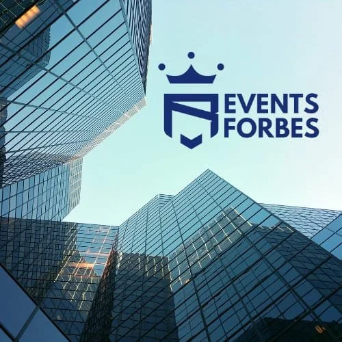 View of tall modern glass office buildings from below with a blue sky background, featuring the Events Forbes logo in the upper right corner.