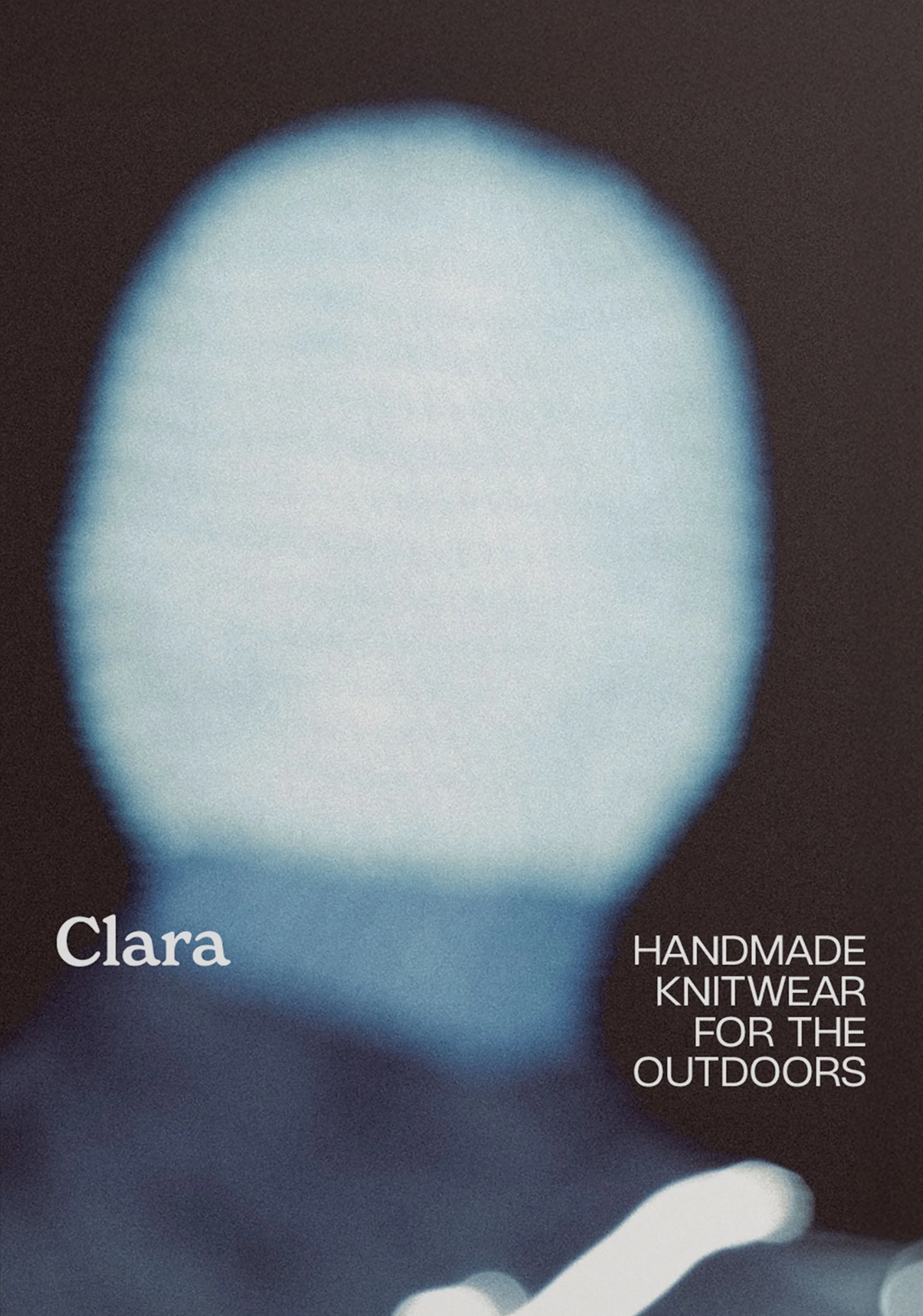 Cover of a Clara Knitwear's Archive zine titled 'Clara - Handmade Knitwear for the Outdoors' with a blurred, glowing blue head in the background.