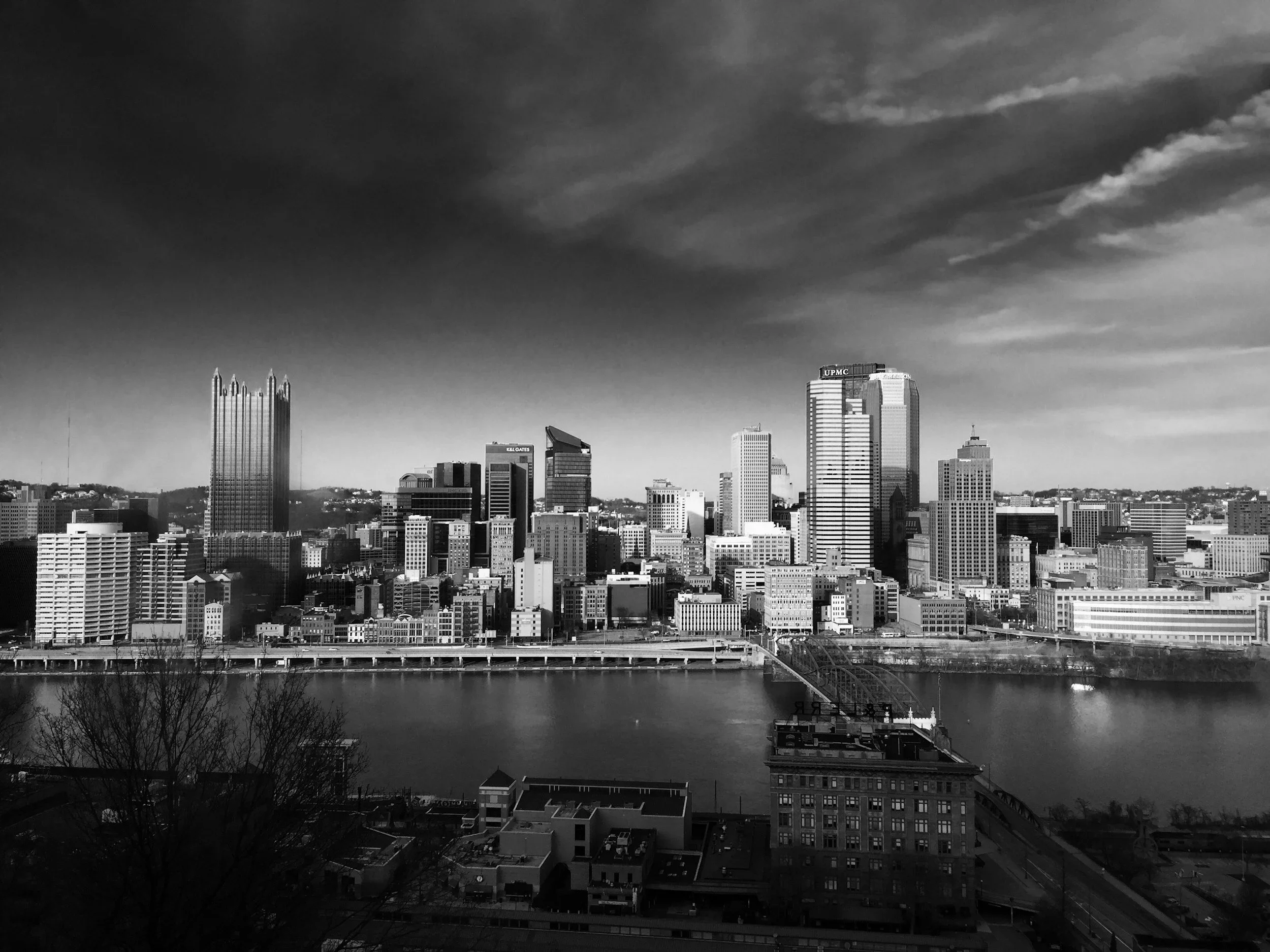 Black and white photograph of the downtown Pittsburgh skyline, representing the local community served by trauma therapist Mariah J. Zur.