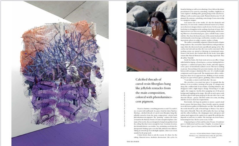 A magazine spread with an abstract artwork on the left page and a woman at the beach with a pink surfboard on the right page.