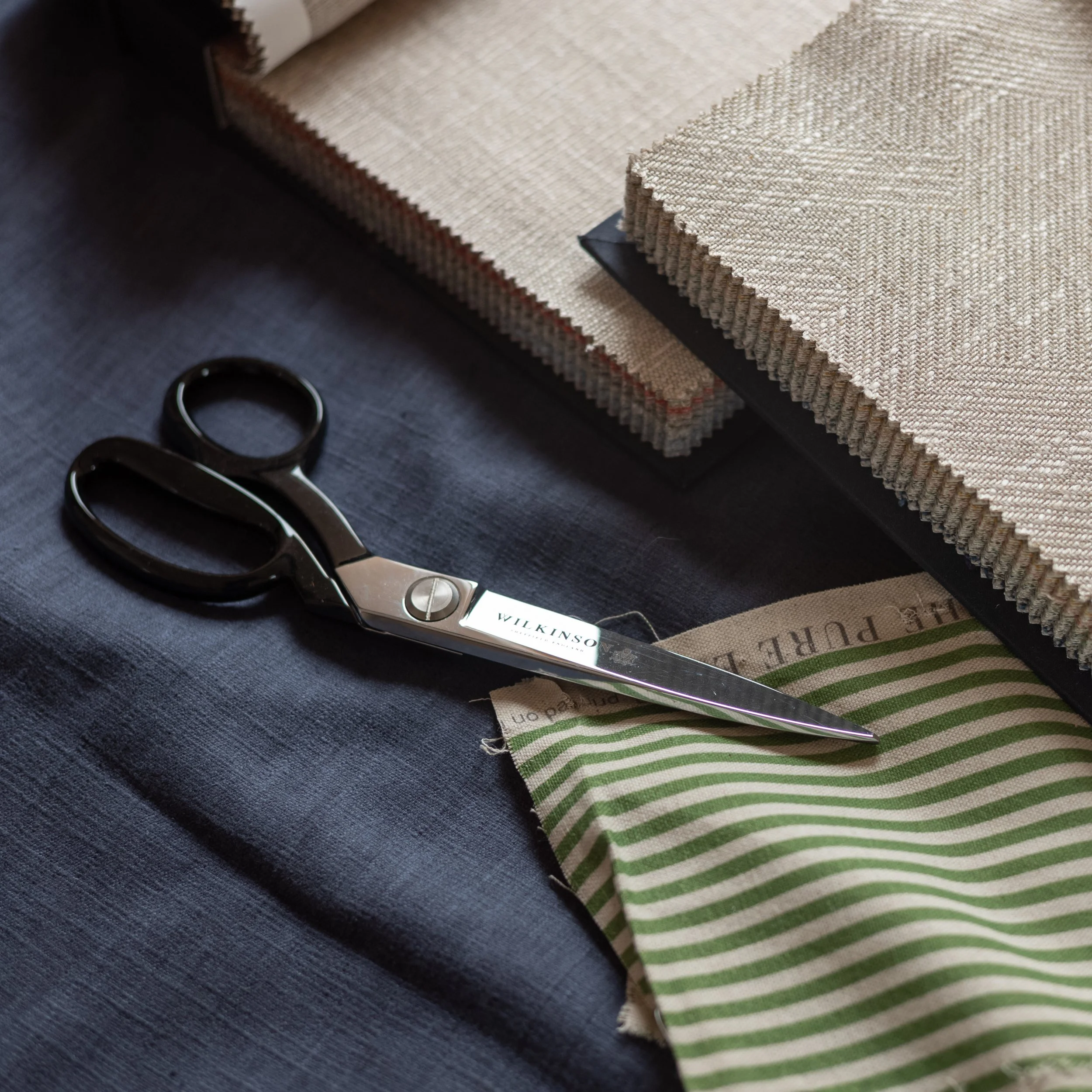 Geometric drawing of an outline square with sections divided by vertical, horizontal, and diagonal lines.