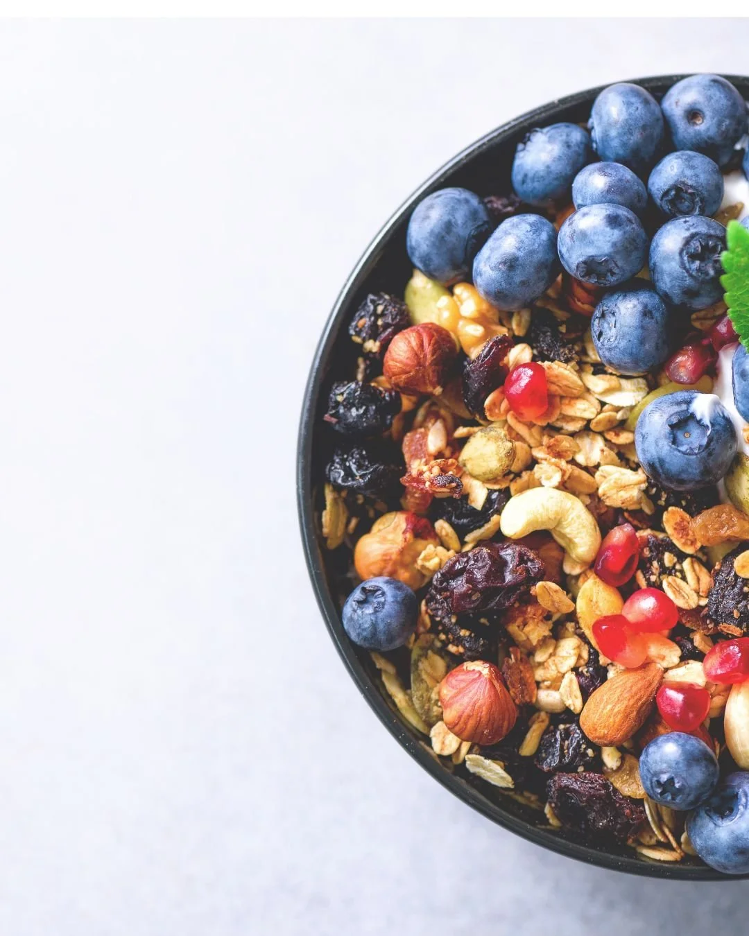 Fibre rich bowl of mussel, nuts and berries for optimum gut health and plant diversity.