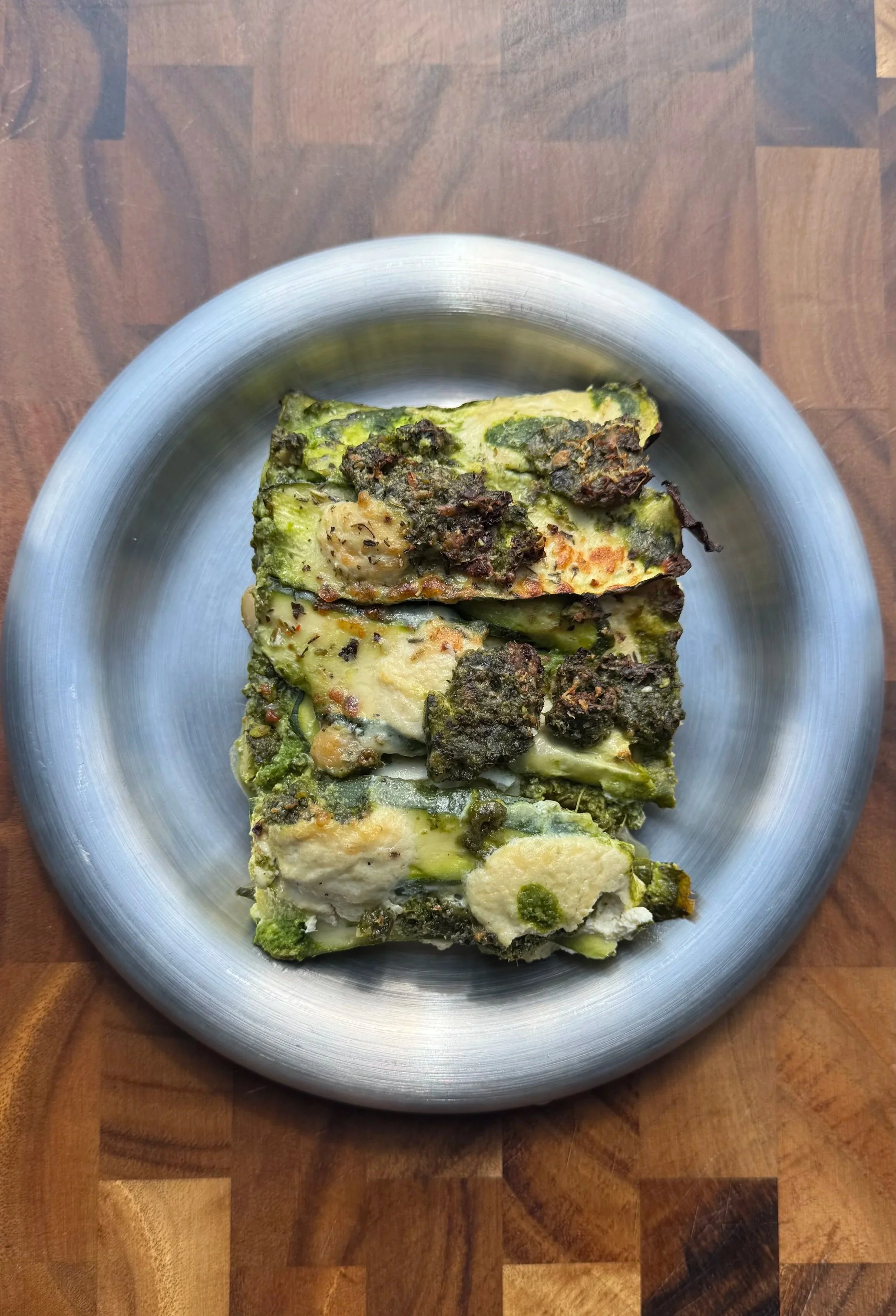 courgette gratin with spinach pesto and tofu ricotta