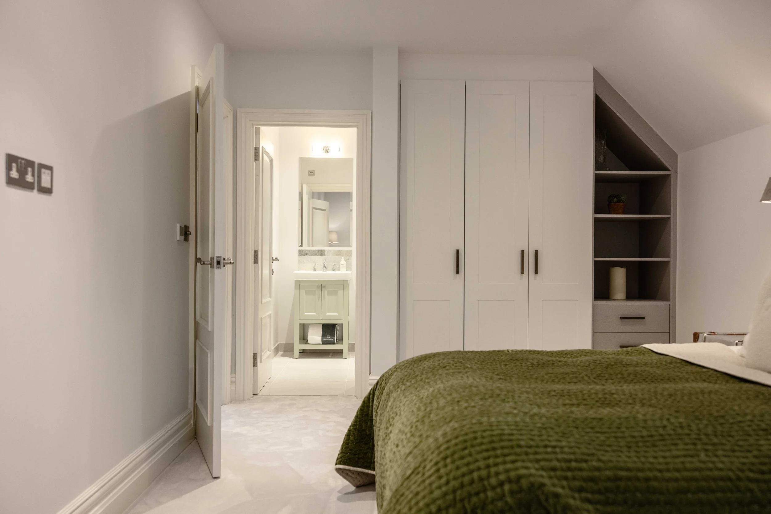 Painted Shaker door with with two panels running into angled ceiling 