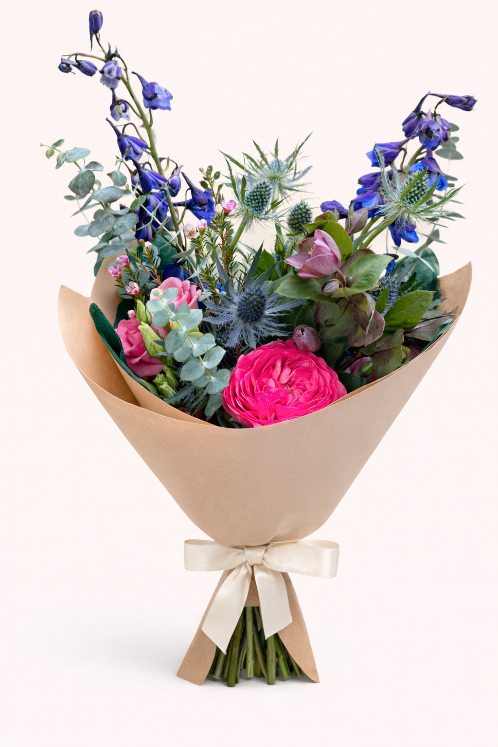 Delicate floral bouquet wrapped in kraft.png